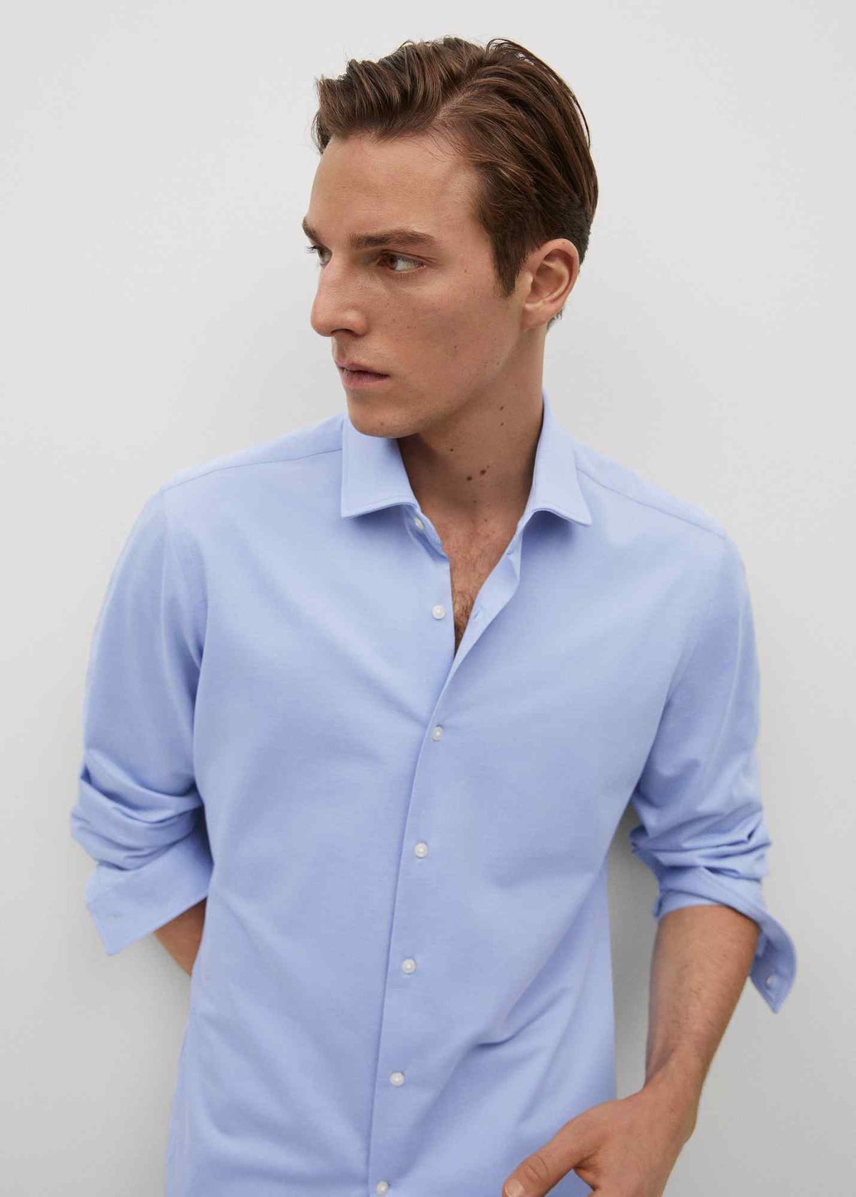 Men's sky-blue button-up shirt, side view, long sleeves, button front