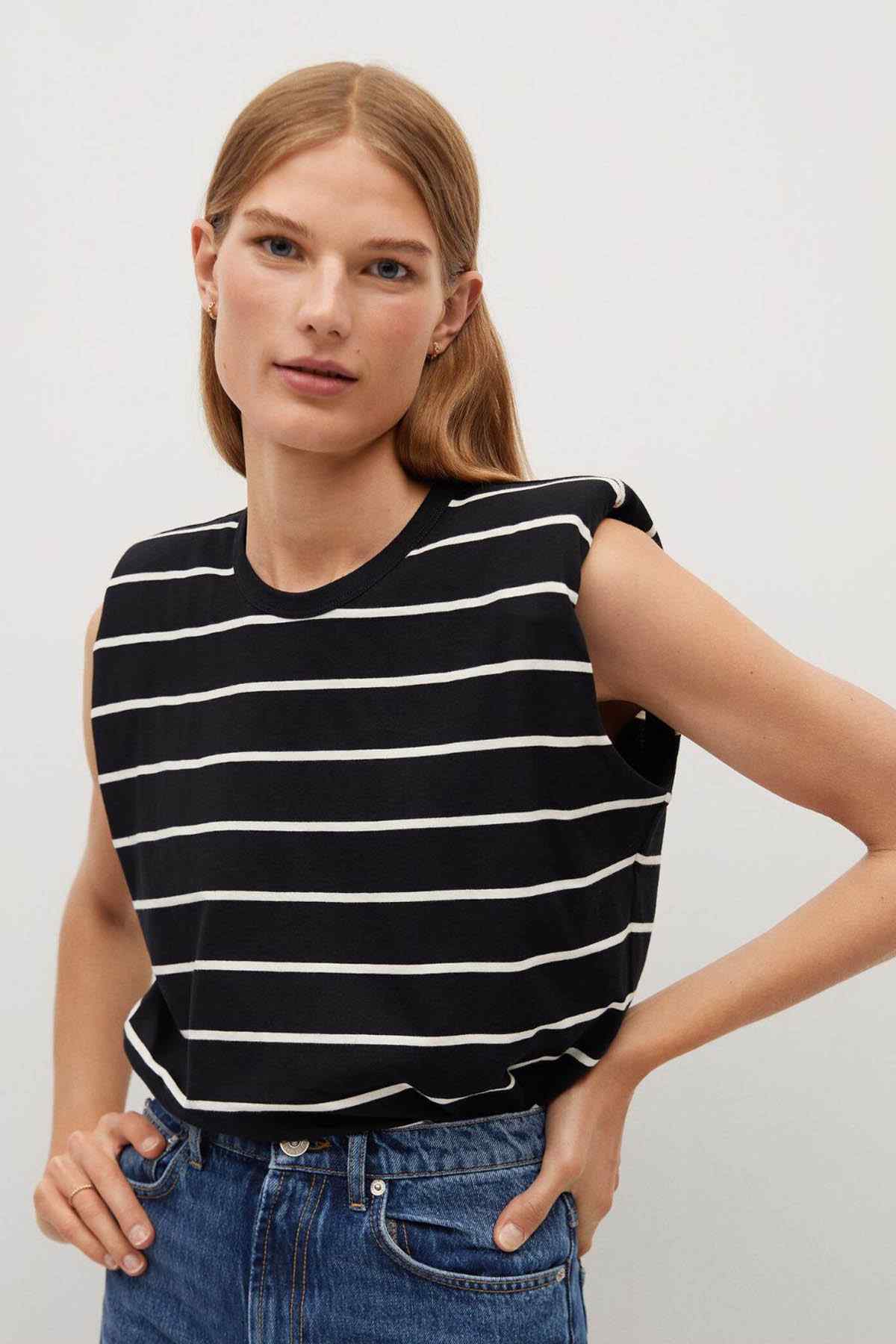 Black and white striped sleeveless top with round neckline