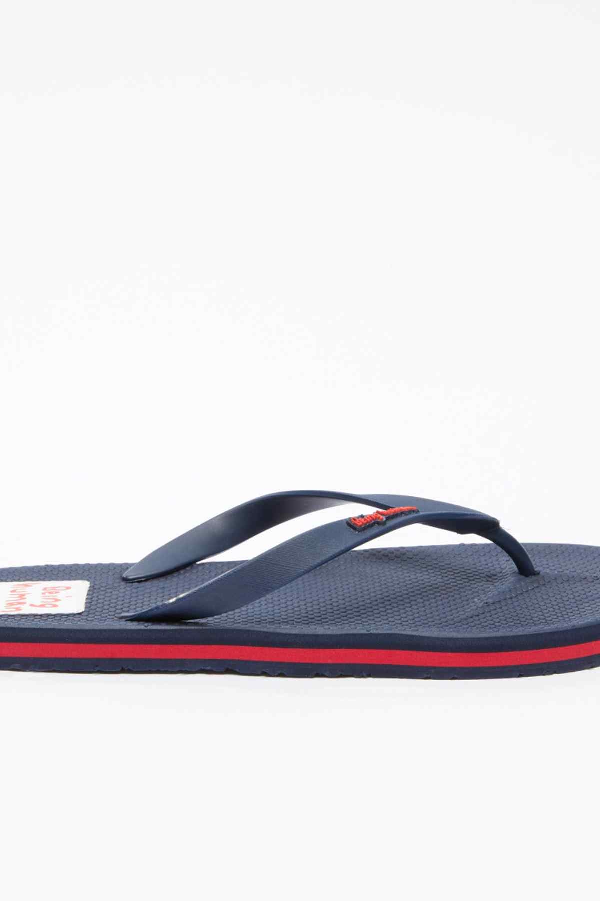 Navy flip-flop with red edge stripe, branded patch and curved thong strap