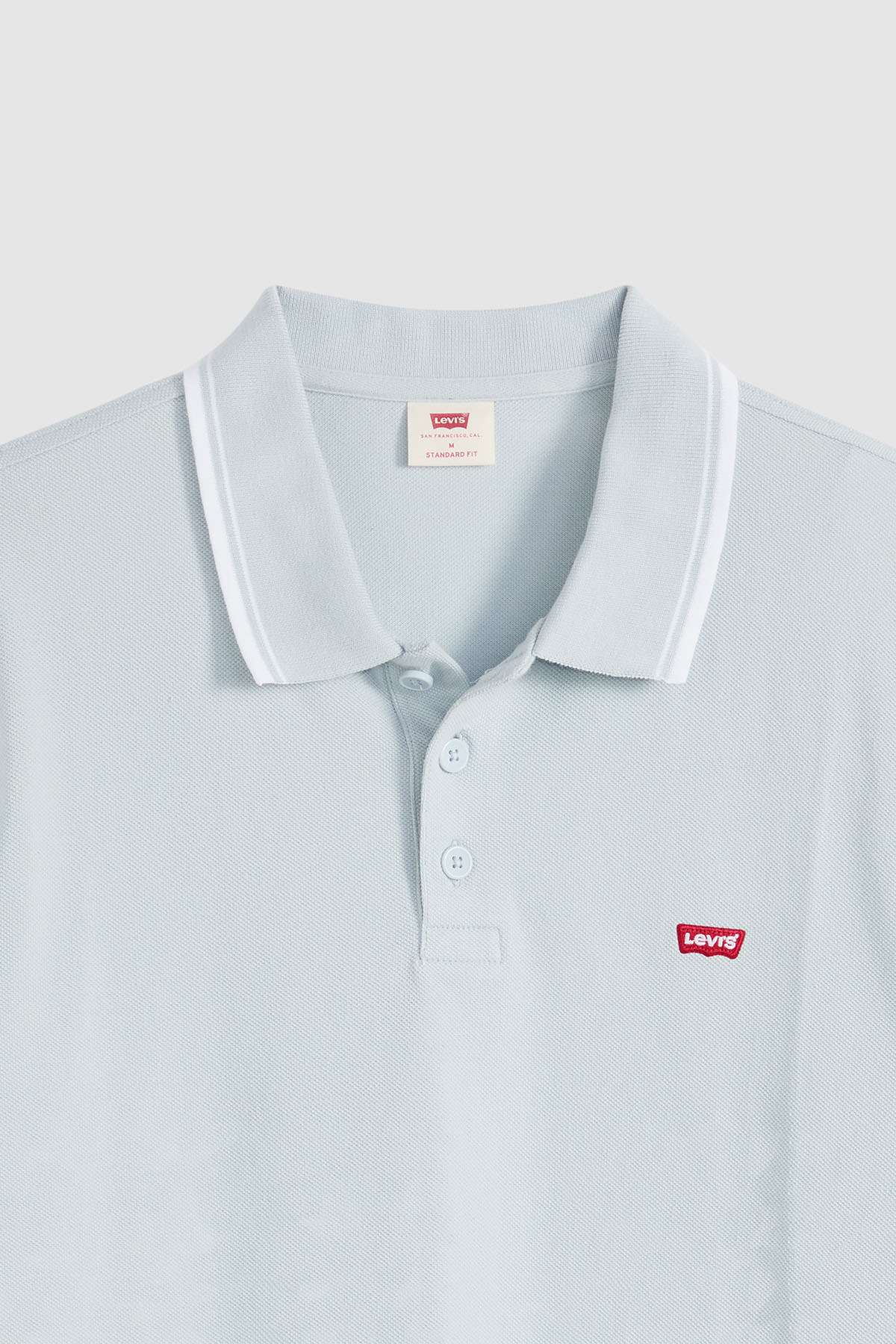 Levi's light blue polo shirt front with three-button placket and chest logo
