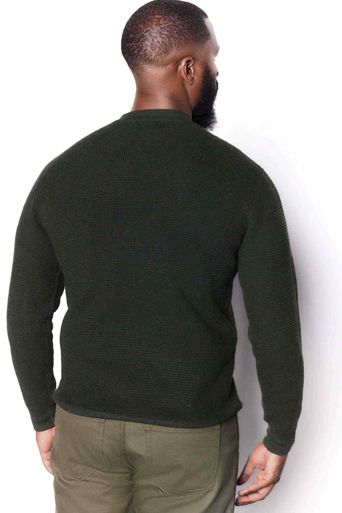 Dark green crewneck sweater back view with long sleeves and ribbed hem
