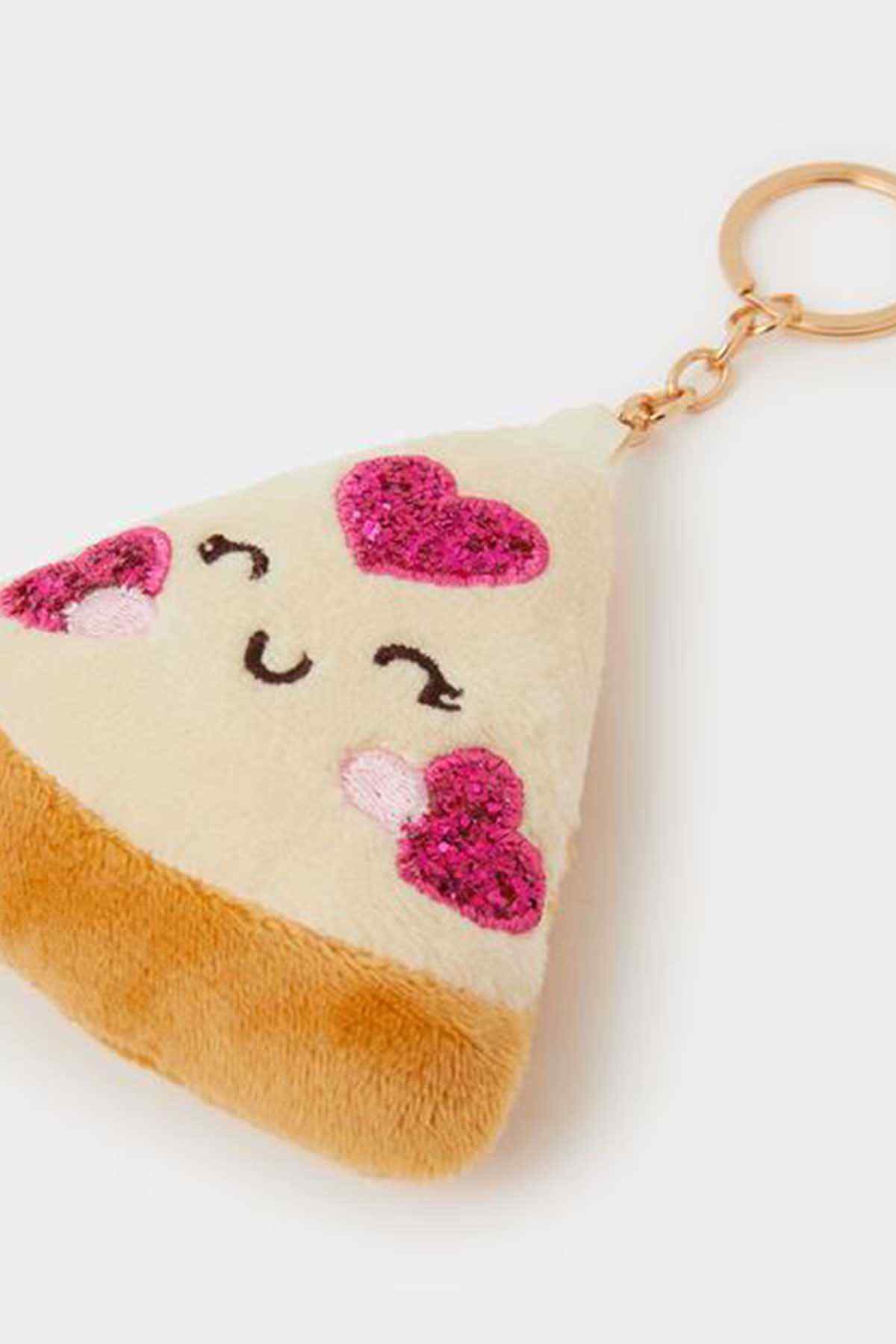 Plush triangle keychain close-up with heart face, gold-tone keyring, pastel multi
