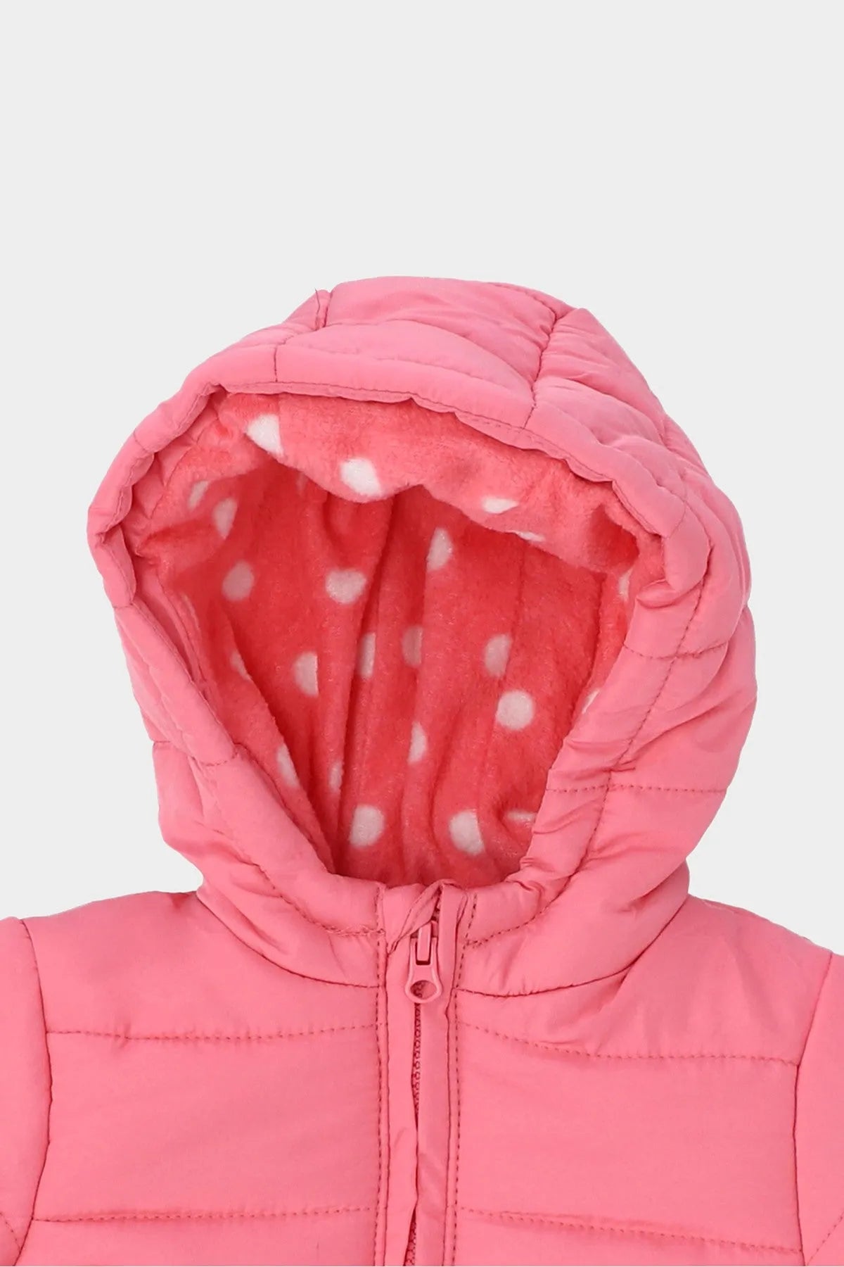 Pink hooded puffer baby jacket close-up: zip and dotted lining inside hood