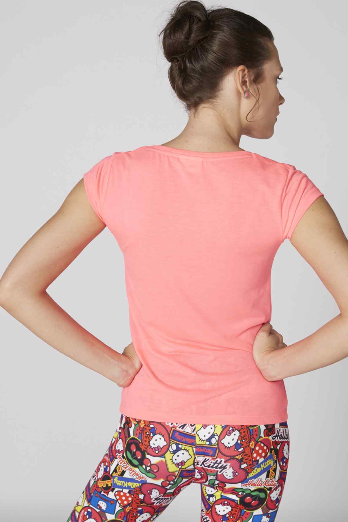 Pink Hello Kitty T-shirt back view with colorful comic leggings