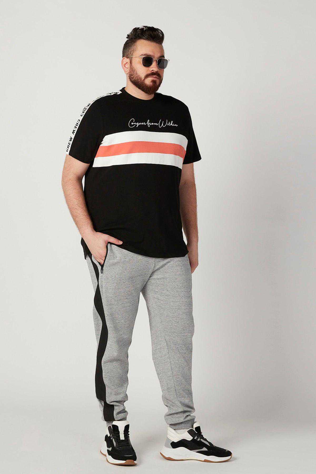 Grey sweatpants with black side stripe and drawstring, tapered fit