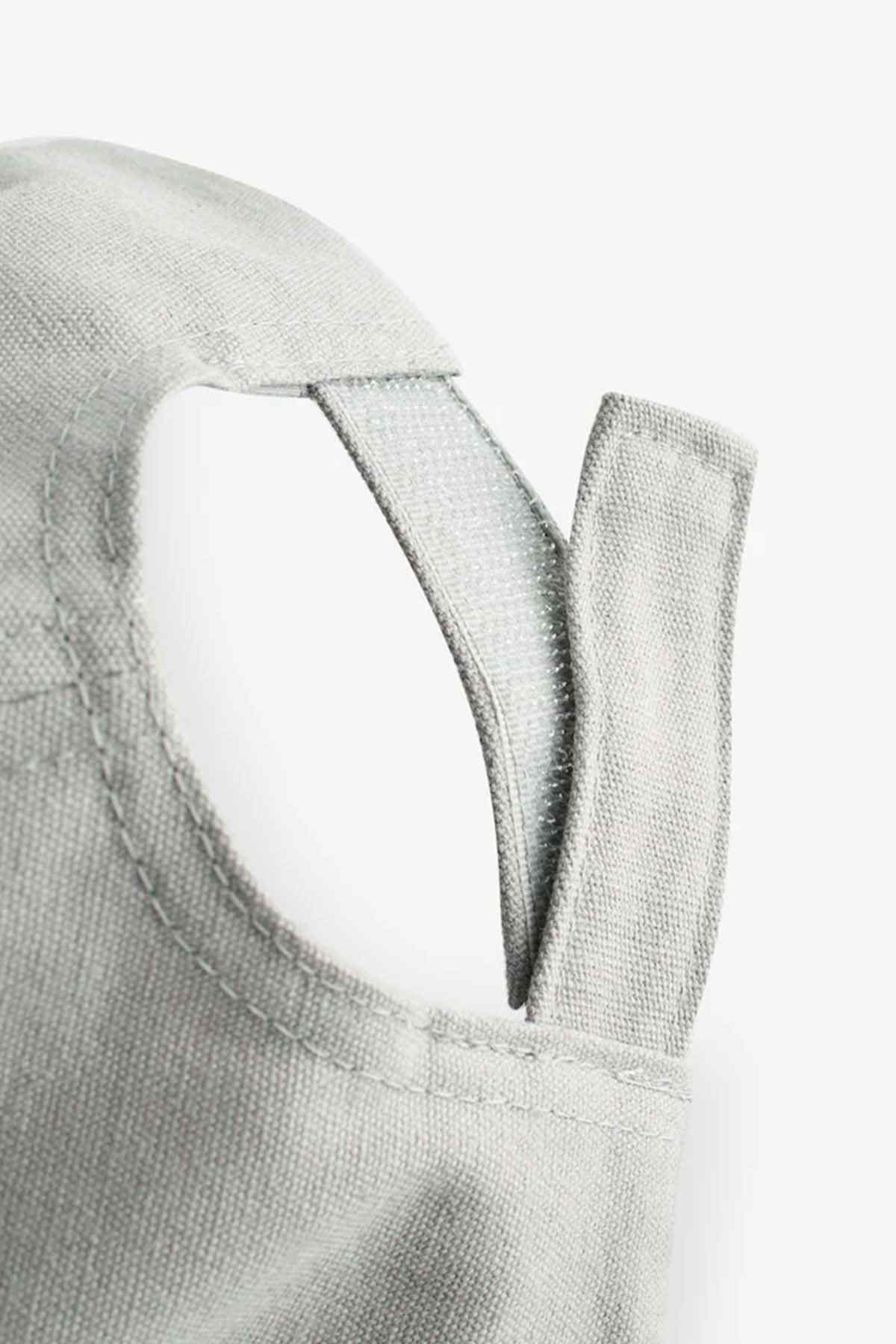 Grey baseball cap front with V-shaped emblem stitch