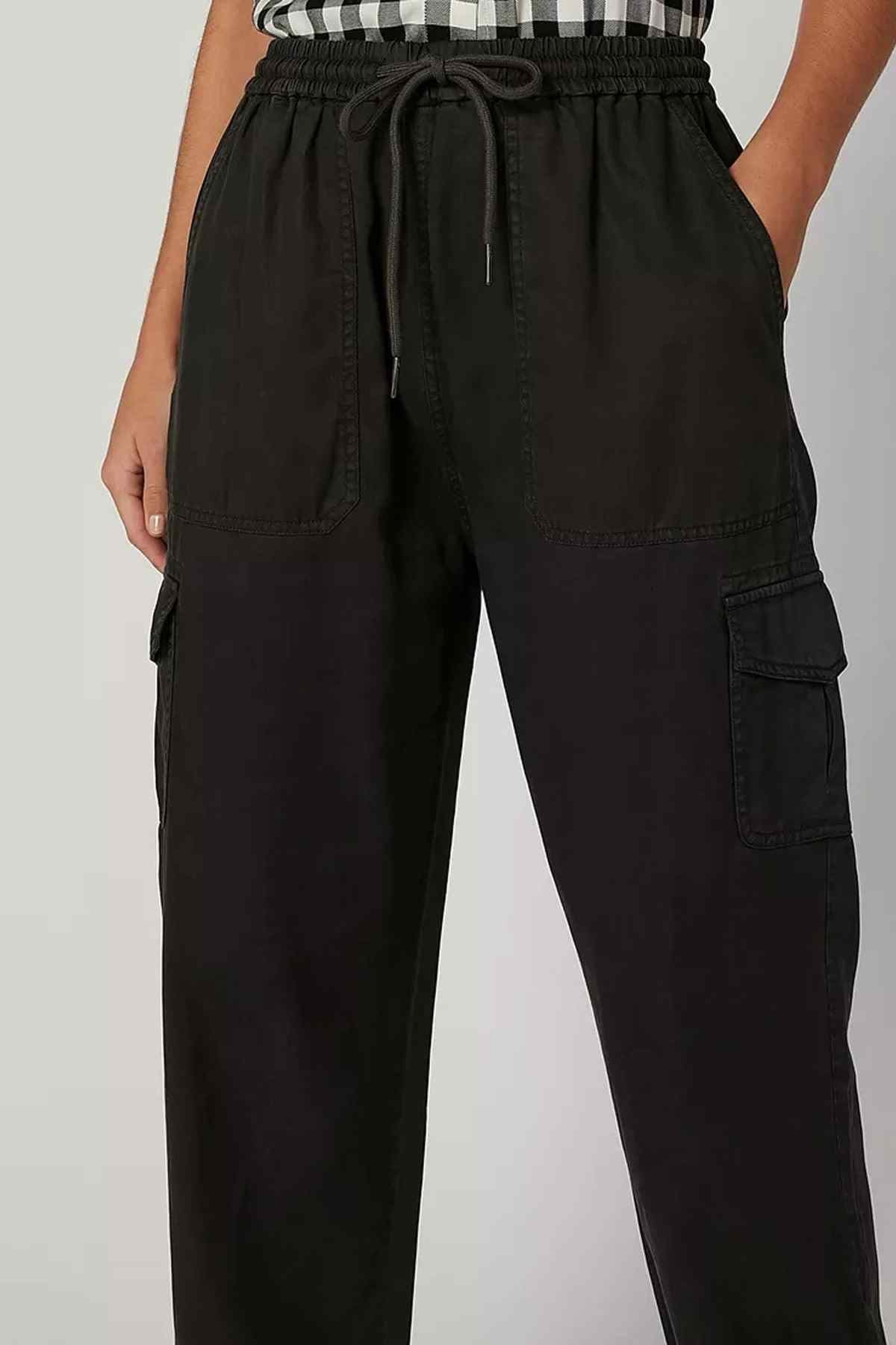 Splash black cargo pants close-up: drawstring waist and stitched cargo pocket on leg
