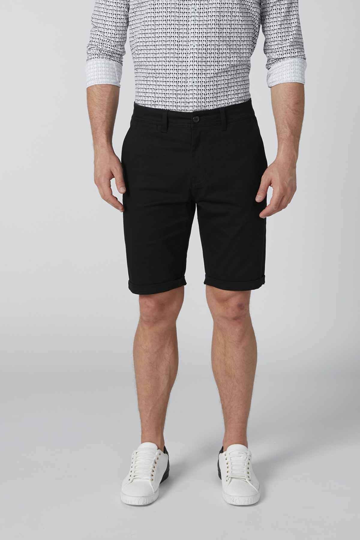 Black knee-length shorts with front pockets, belt loops, and straight leg hem