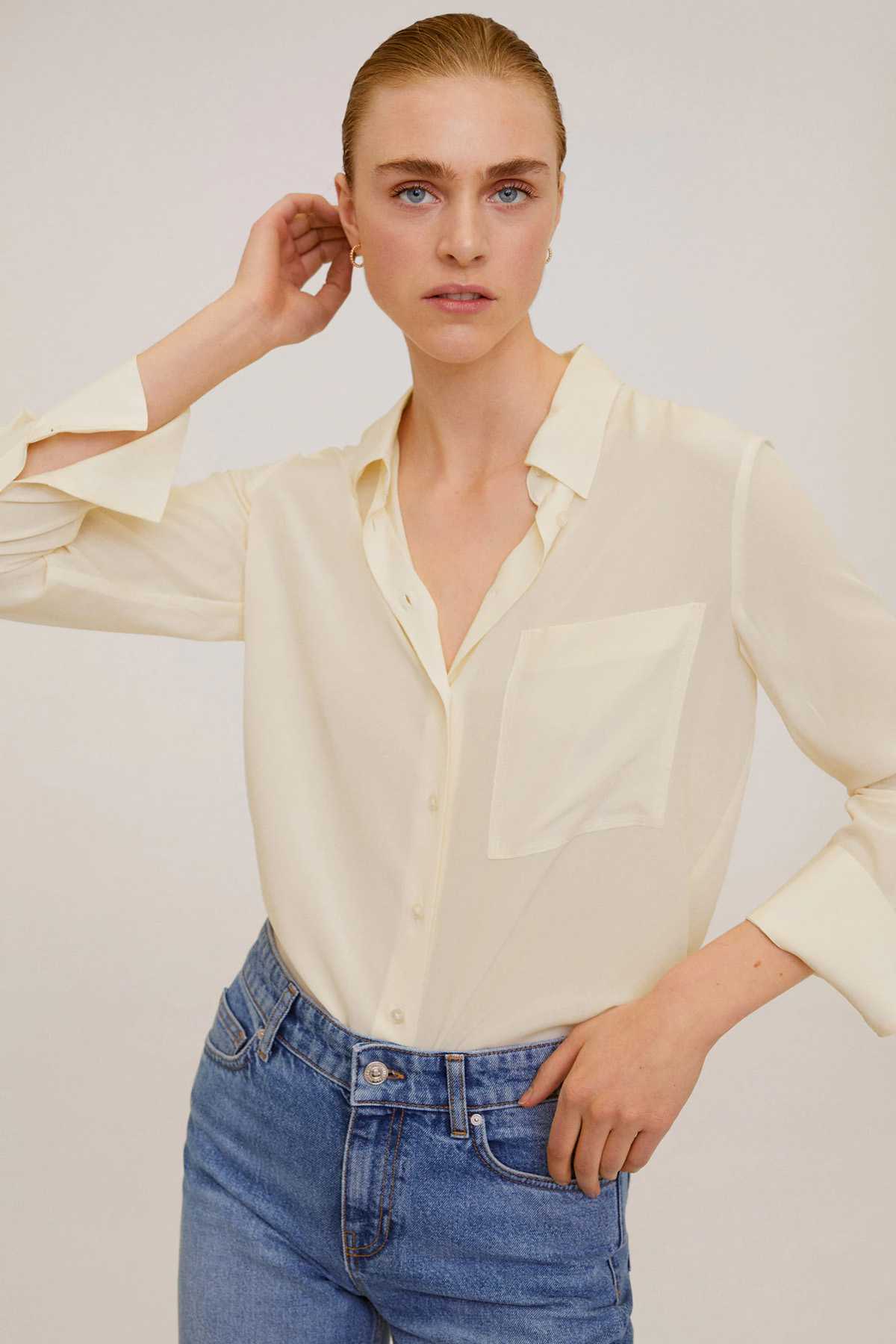 Off-white button-up blouse with pointed collar and chest pocket