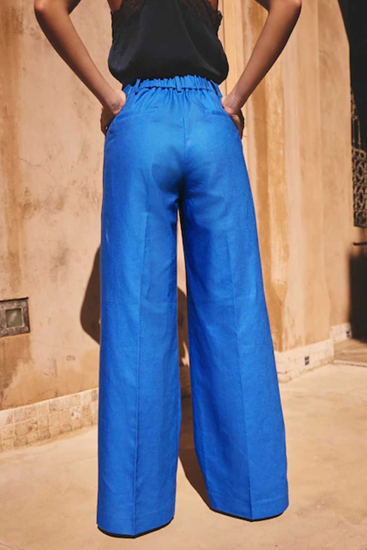 Women’s blue wide-leg trousers with elasticated high waist and deep back crease