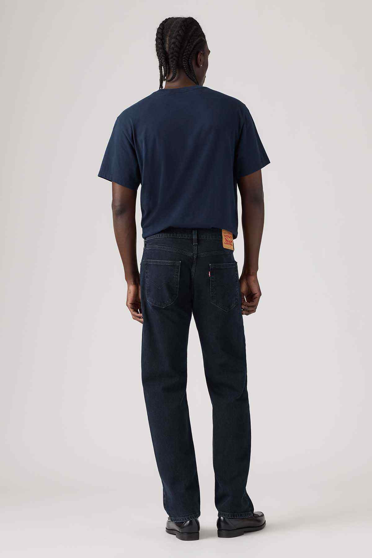 Dark blue denim jeans, back view with yoke and rear pockets
