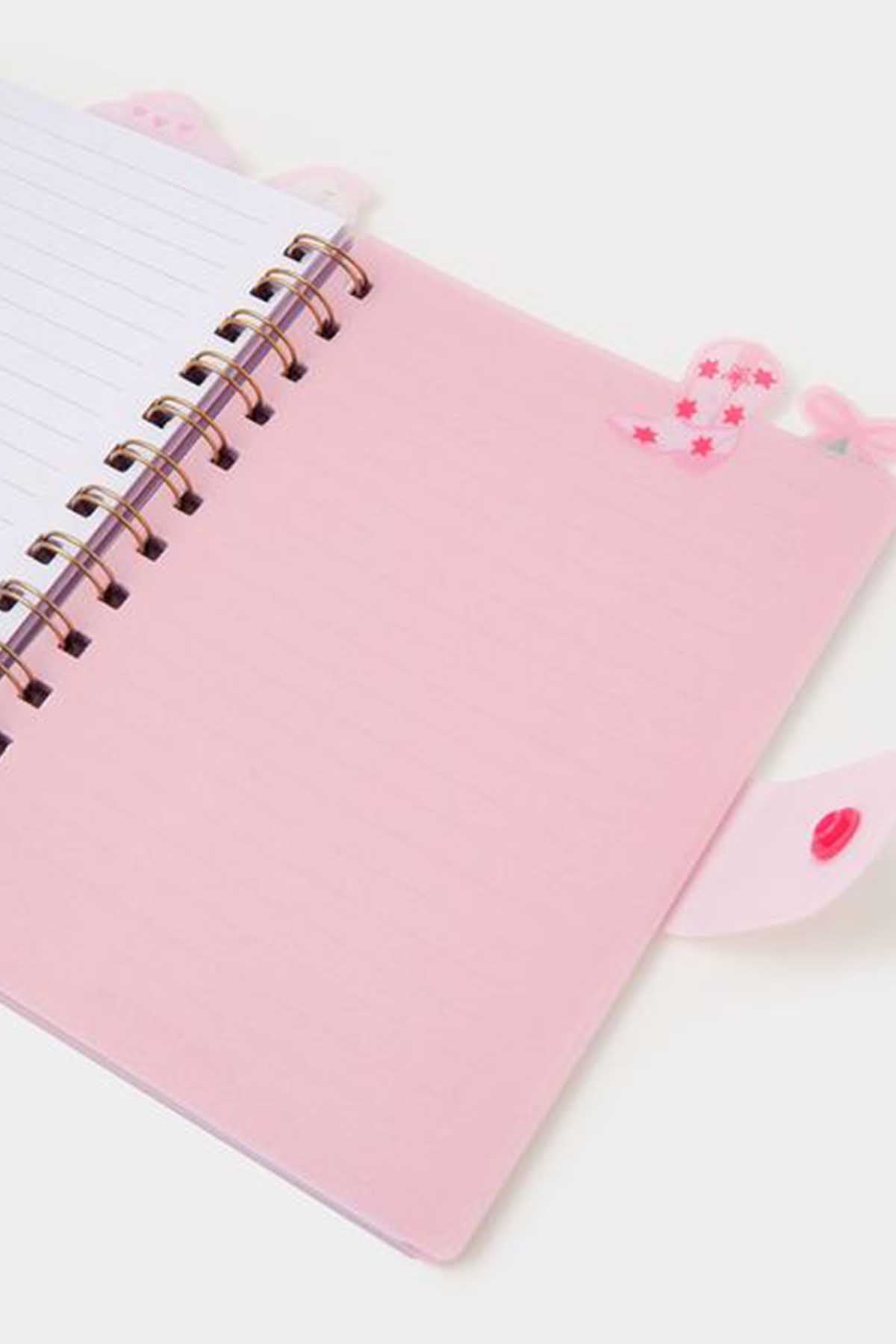 Accessorize pink spiral notebook, lined pages view, heart detail on cover pocket