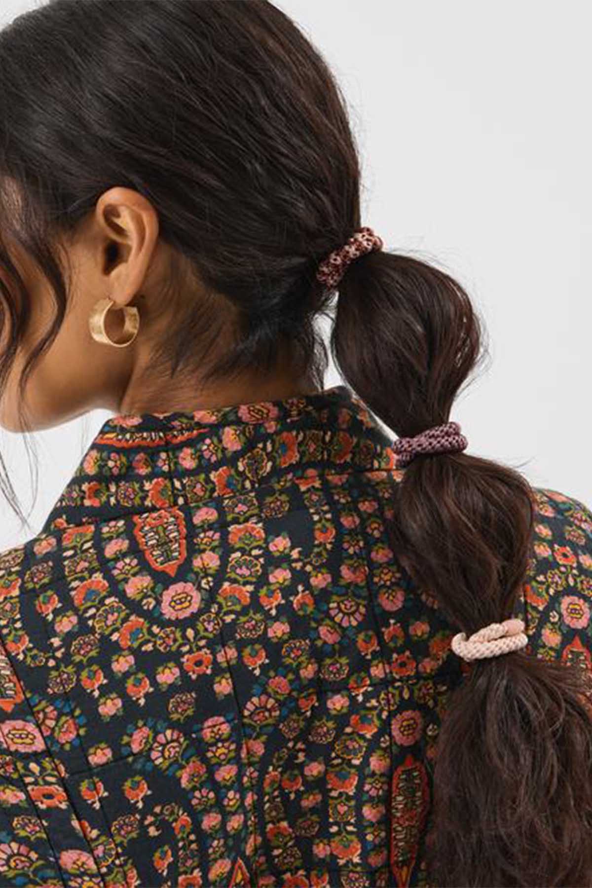 Accessorize braided hair elastics in dark multi tones on ponytail
