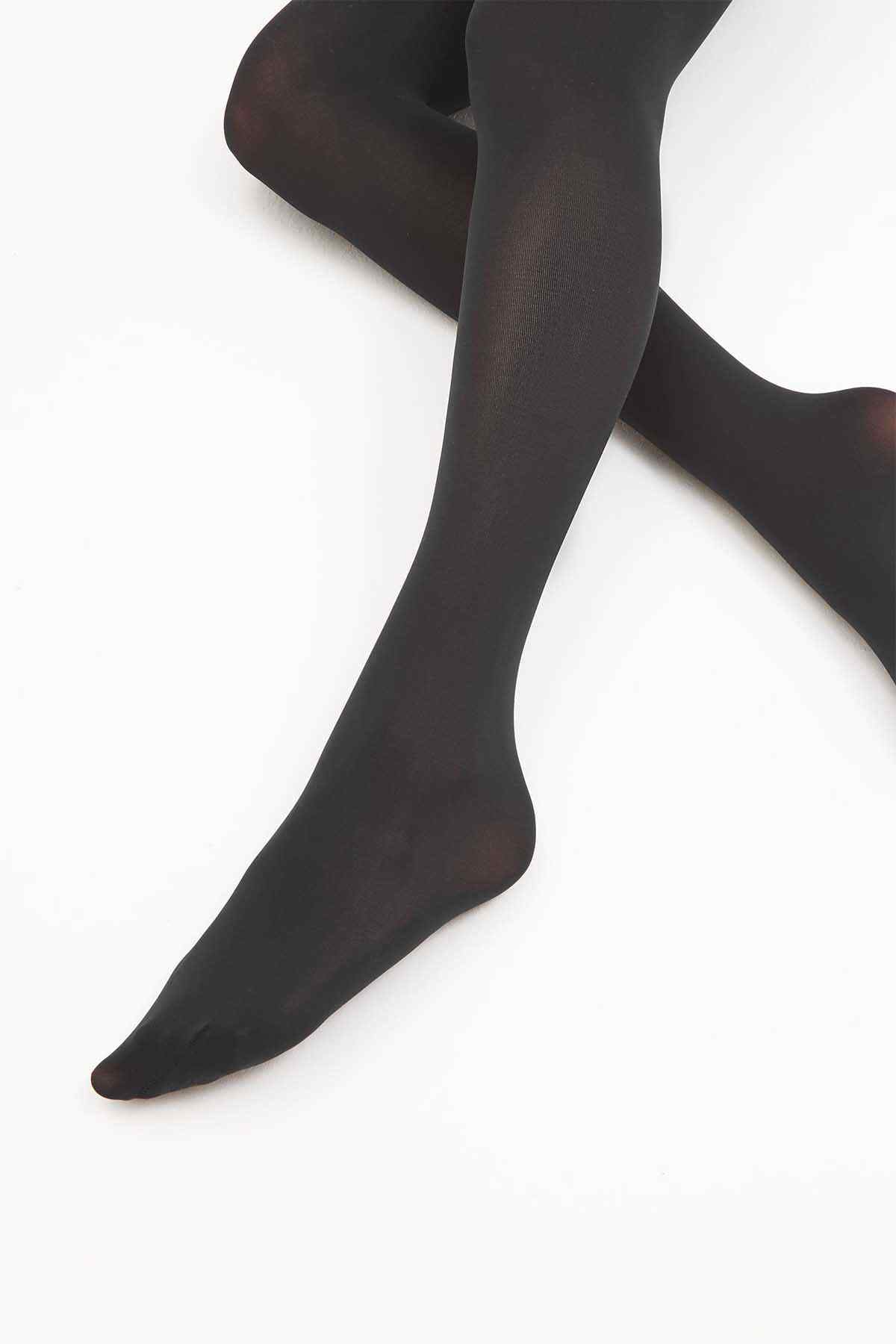 Black sheer tights with smooth coverage from ankle to foot