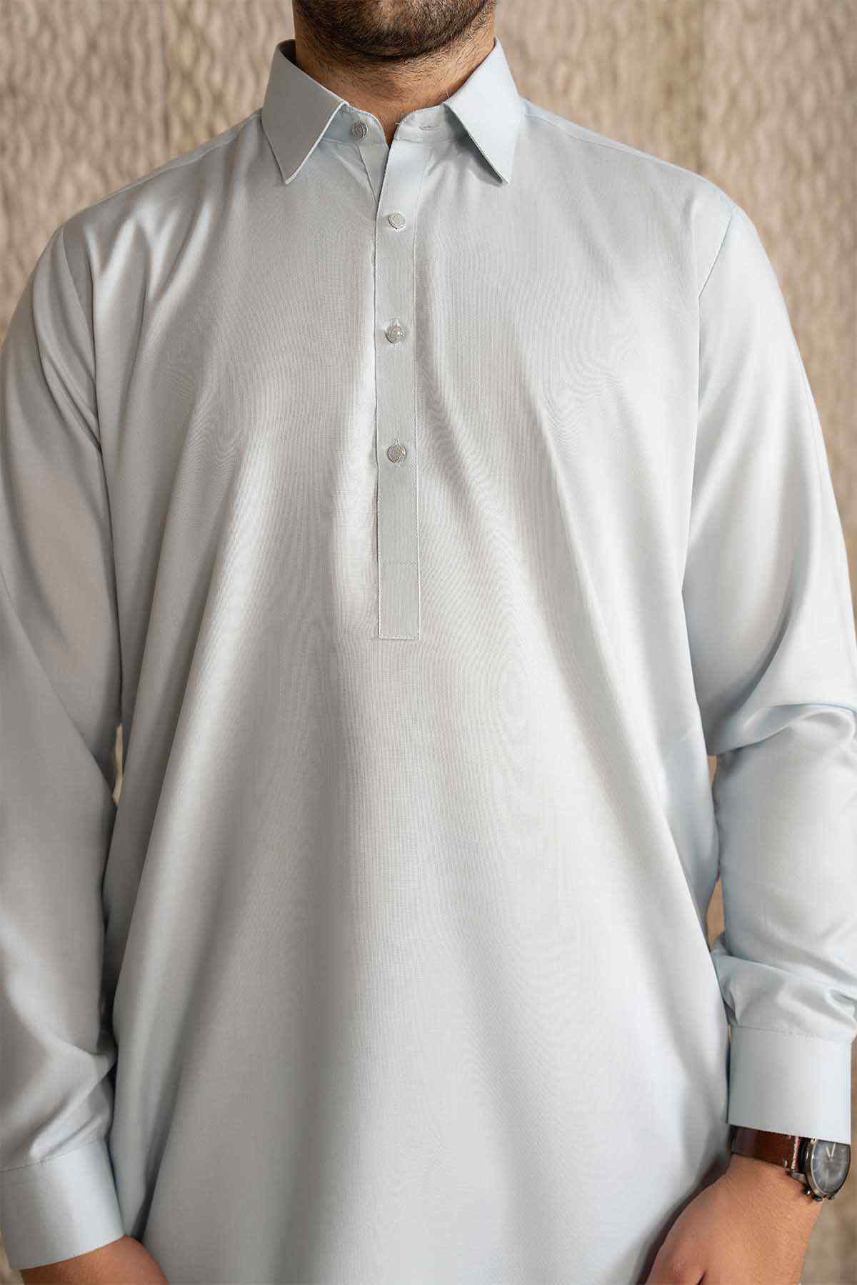 Buraq official ice blue kurta with stand collar and button row, upper-body close-up.