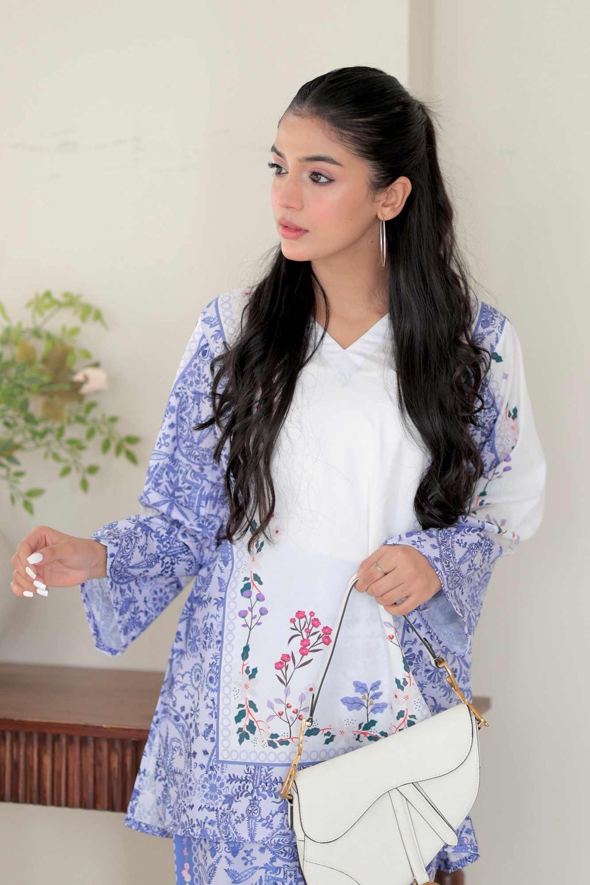 Women’s blue floral printed kurta with white inner top, long sleeves and side tie