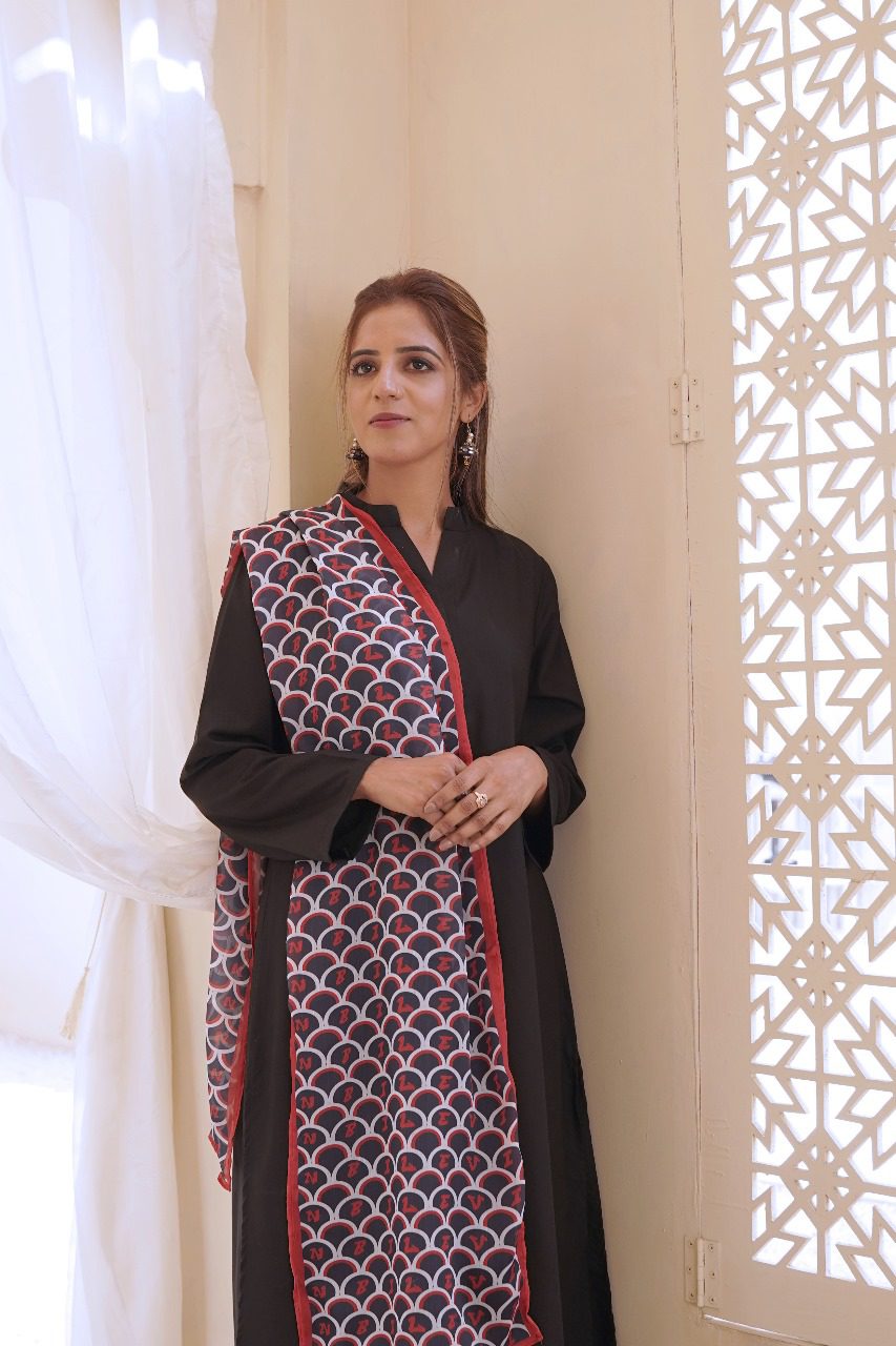 Women's black kurta with red circular print panel