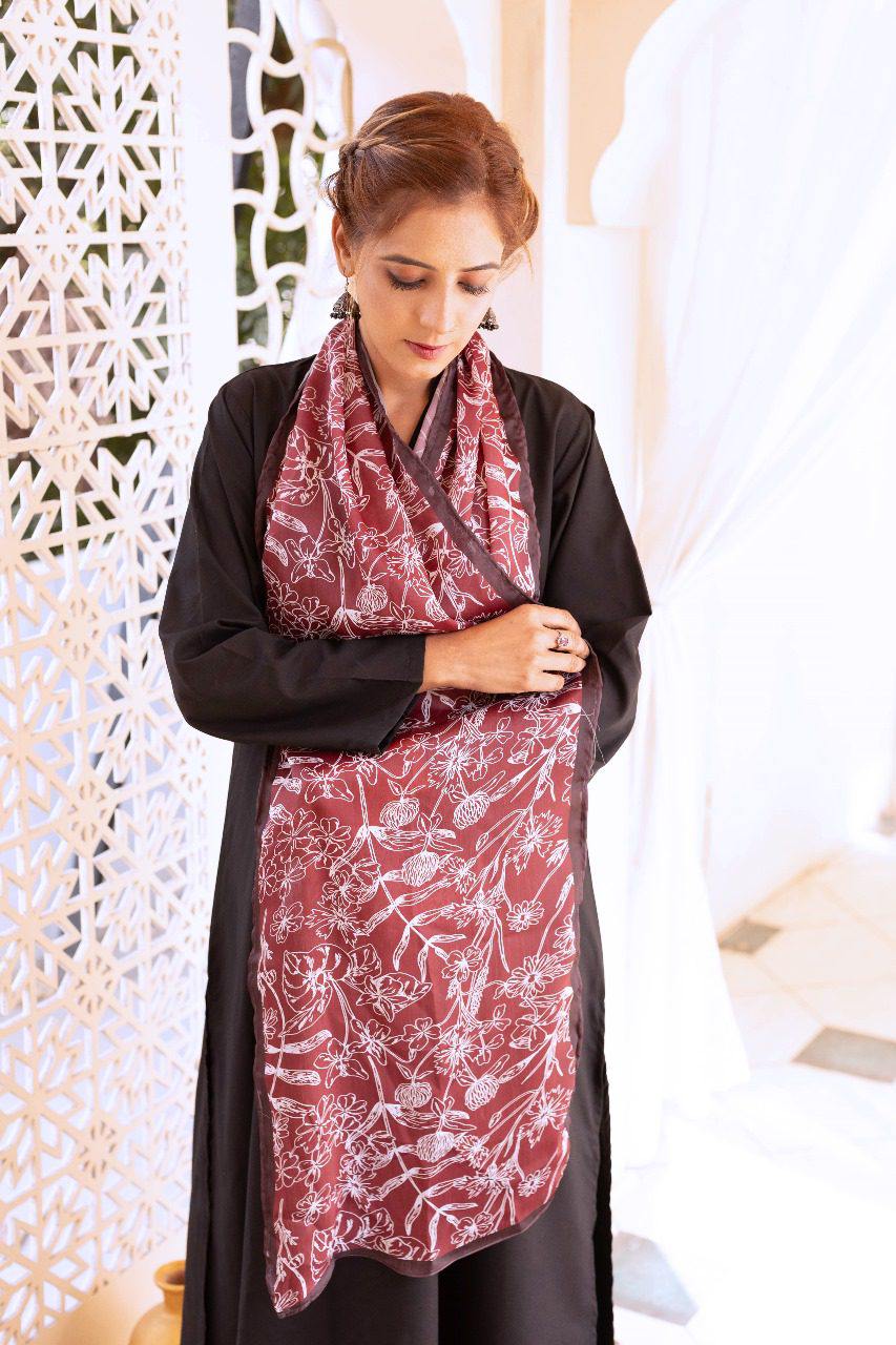 Women's black outer robe with maroon patterned dupatta scarf, draped over shoulders