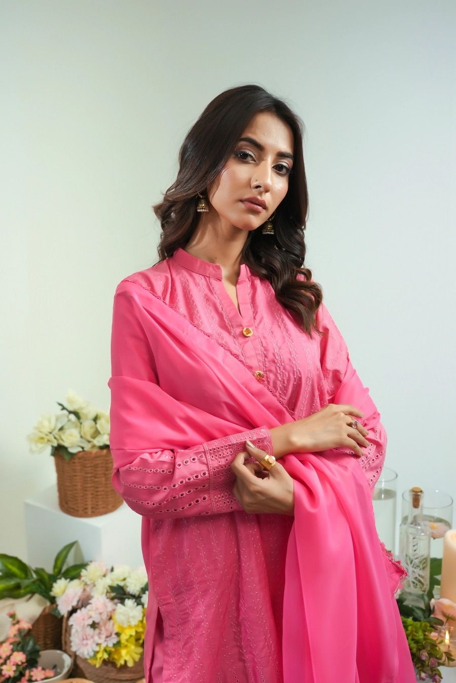 Pink embroidered tunic with stand collar and button front detail, long sleeves.