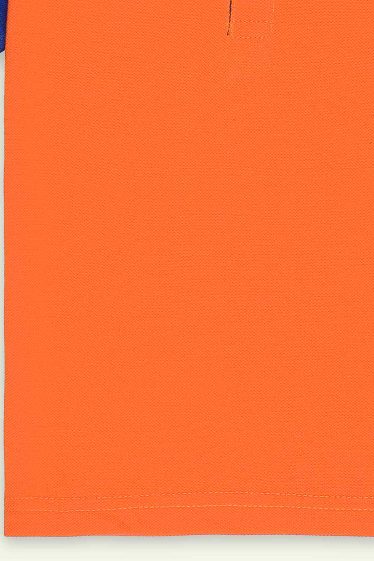 Orange polo shirt hem with stitched edge