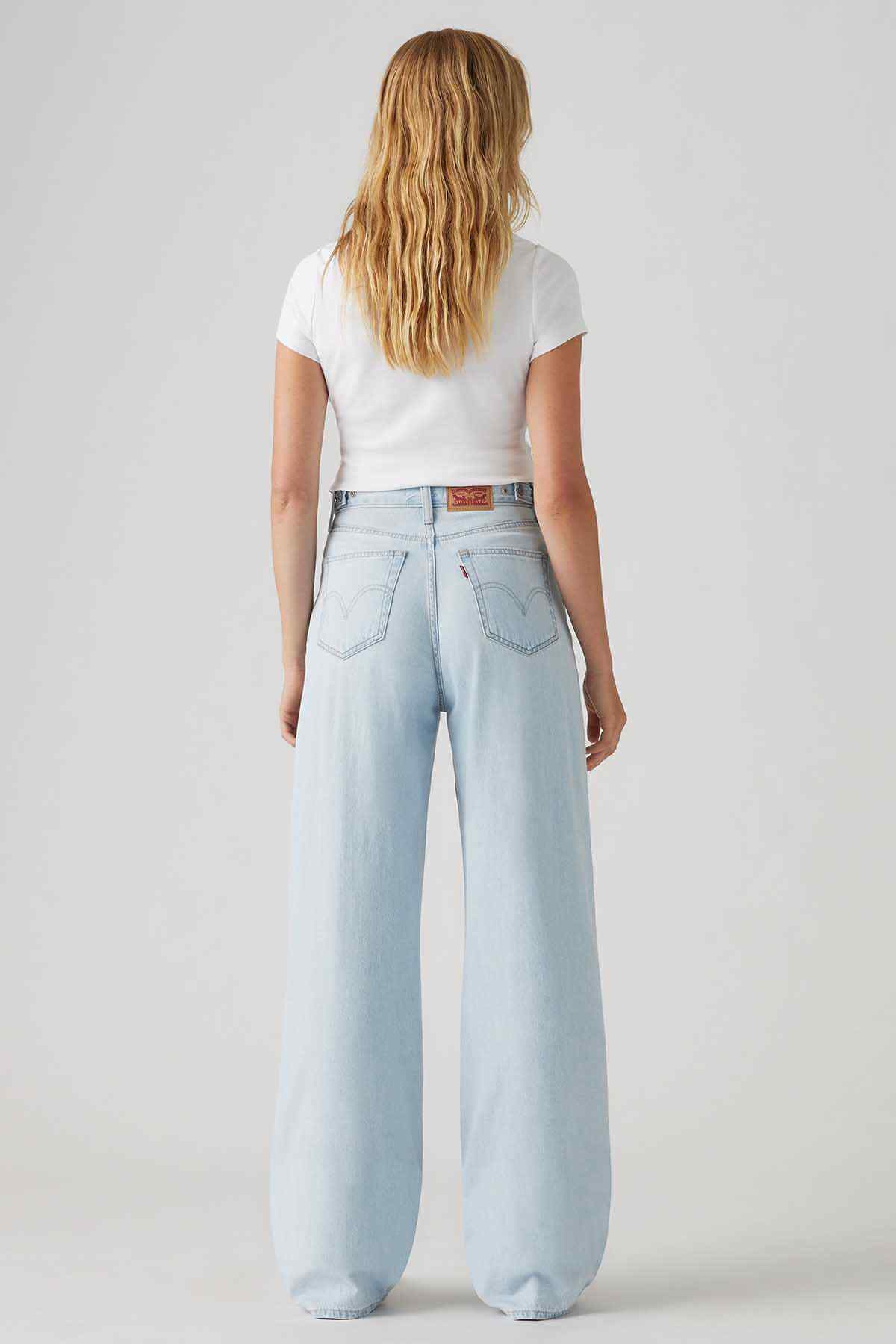 Light indigo wide-leg jeans, back view with waistband and back pockets.