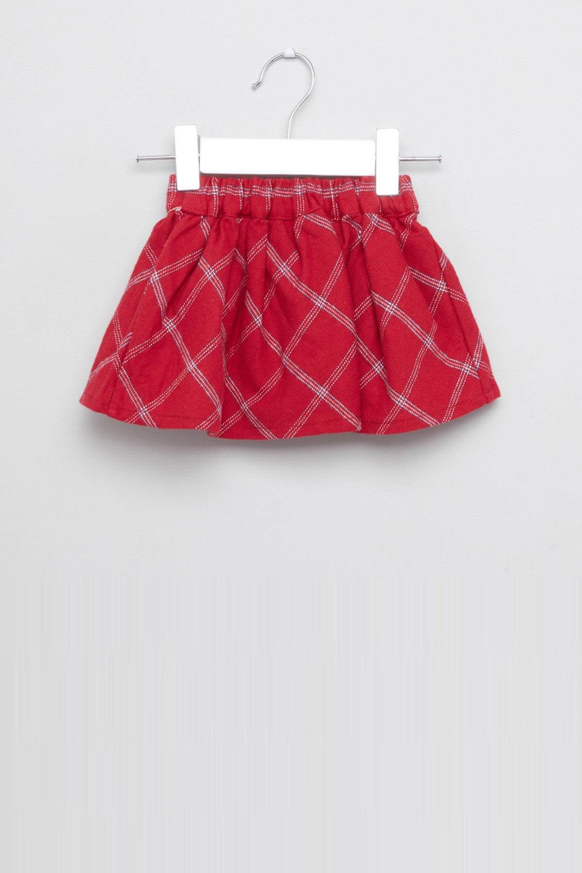 Red plaid baby skirt on hanger with bow accent