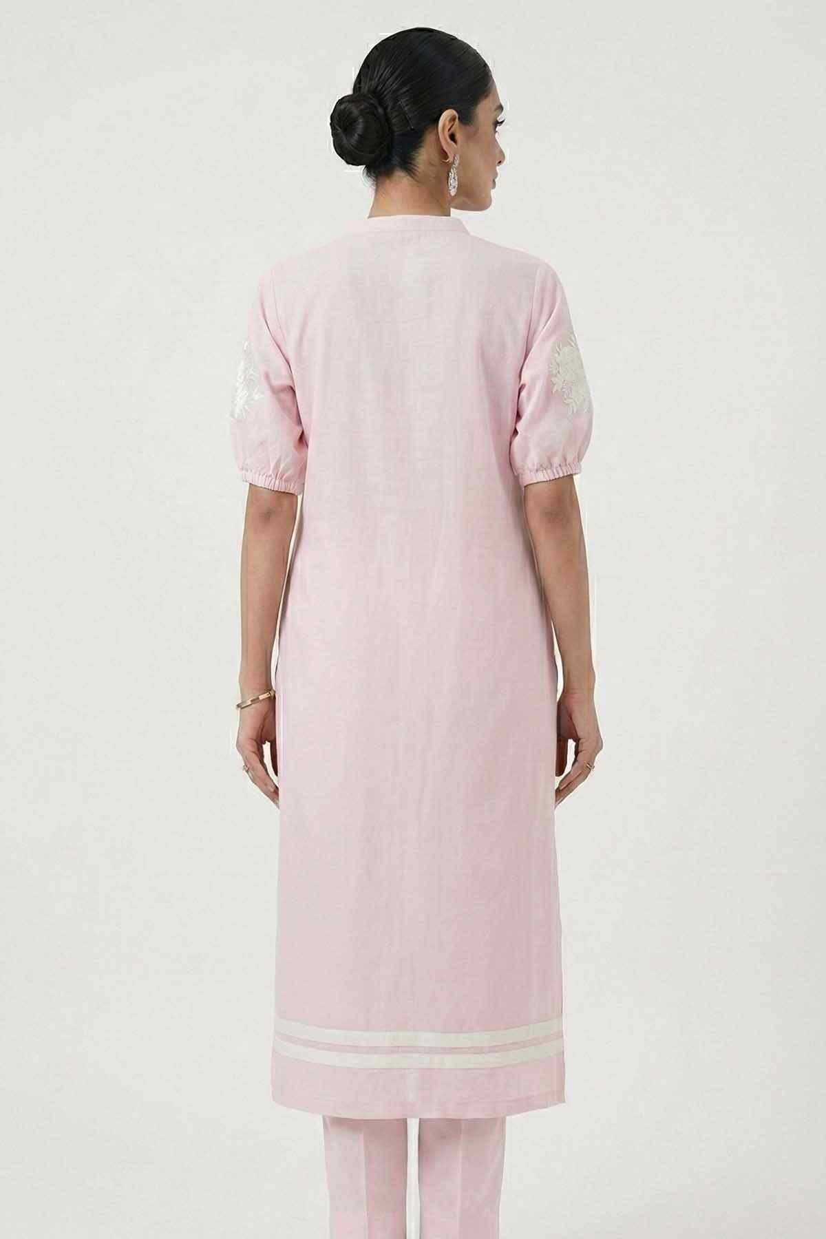 Light pink kurta back view with short sleeves and white embroidered border at hem