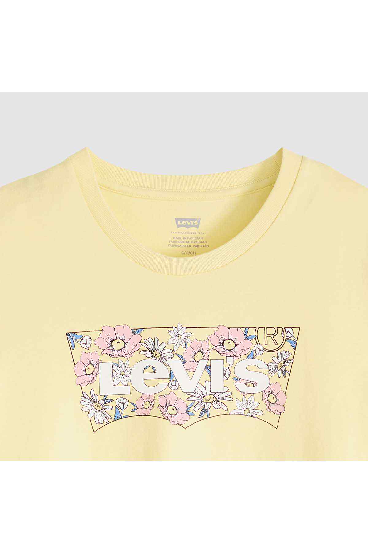 Yellow T-shirt close-up: crew neck and floral front logo graphic in pastel colors