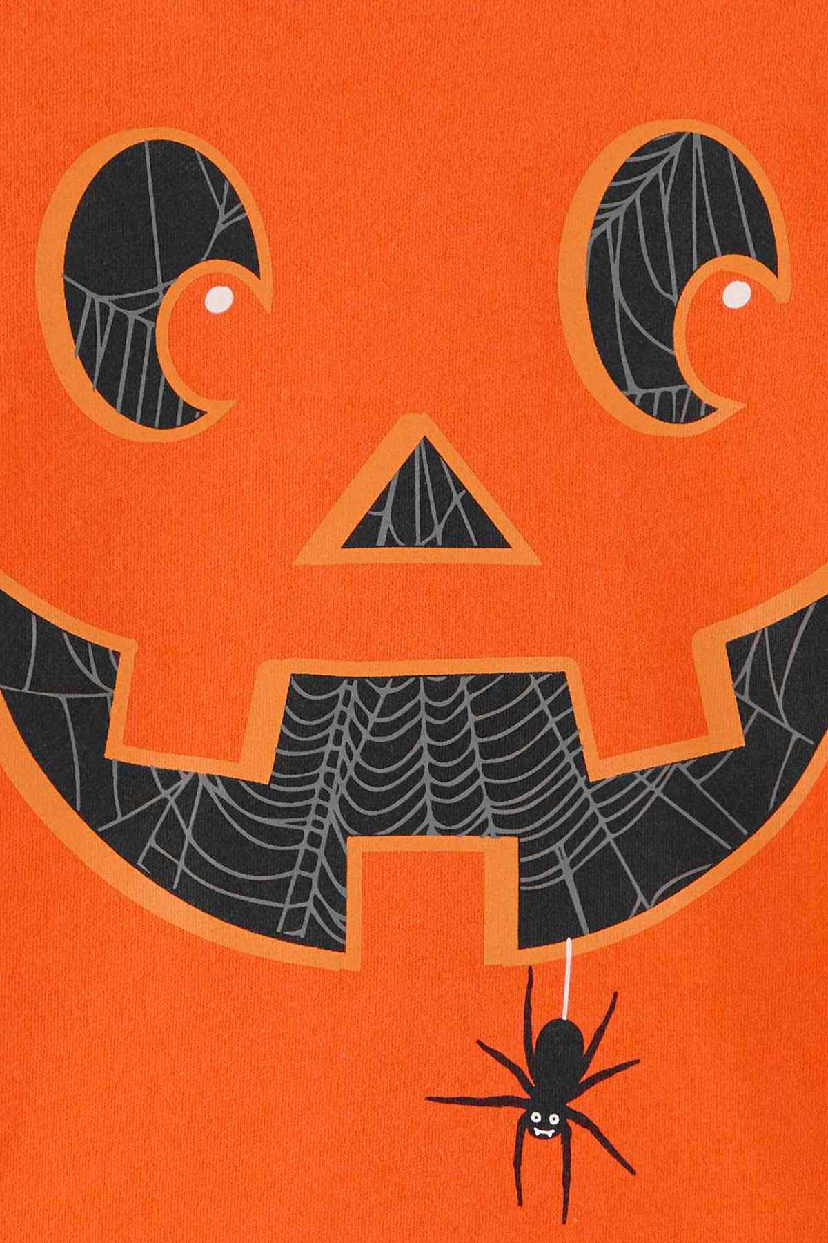 Orange long-sleeve T-shirt close-up: jack-o’-lantern face graphic with spider