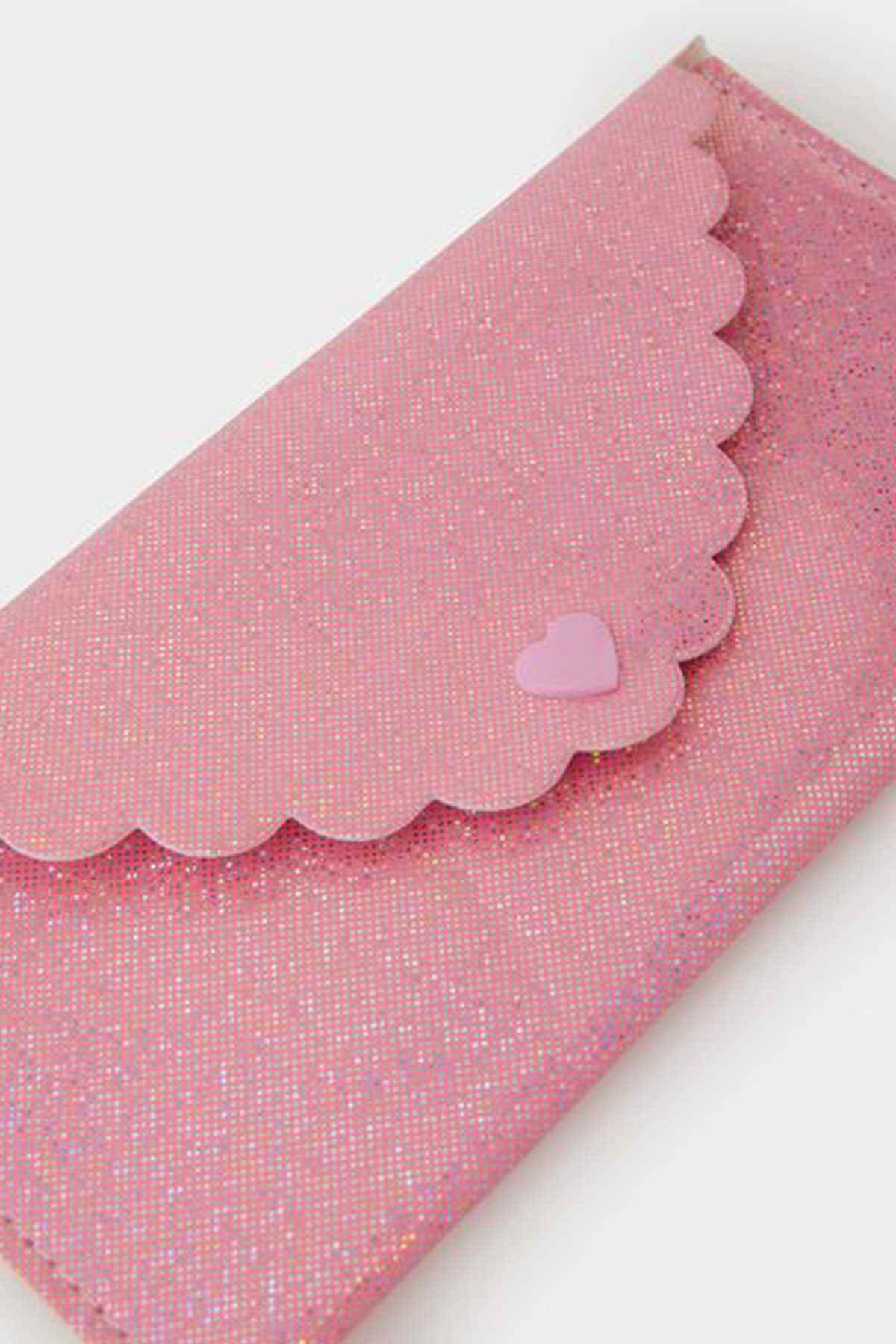 Pink glitter pouch with scalloped edge and heart applique on the trim