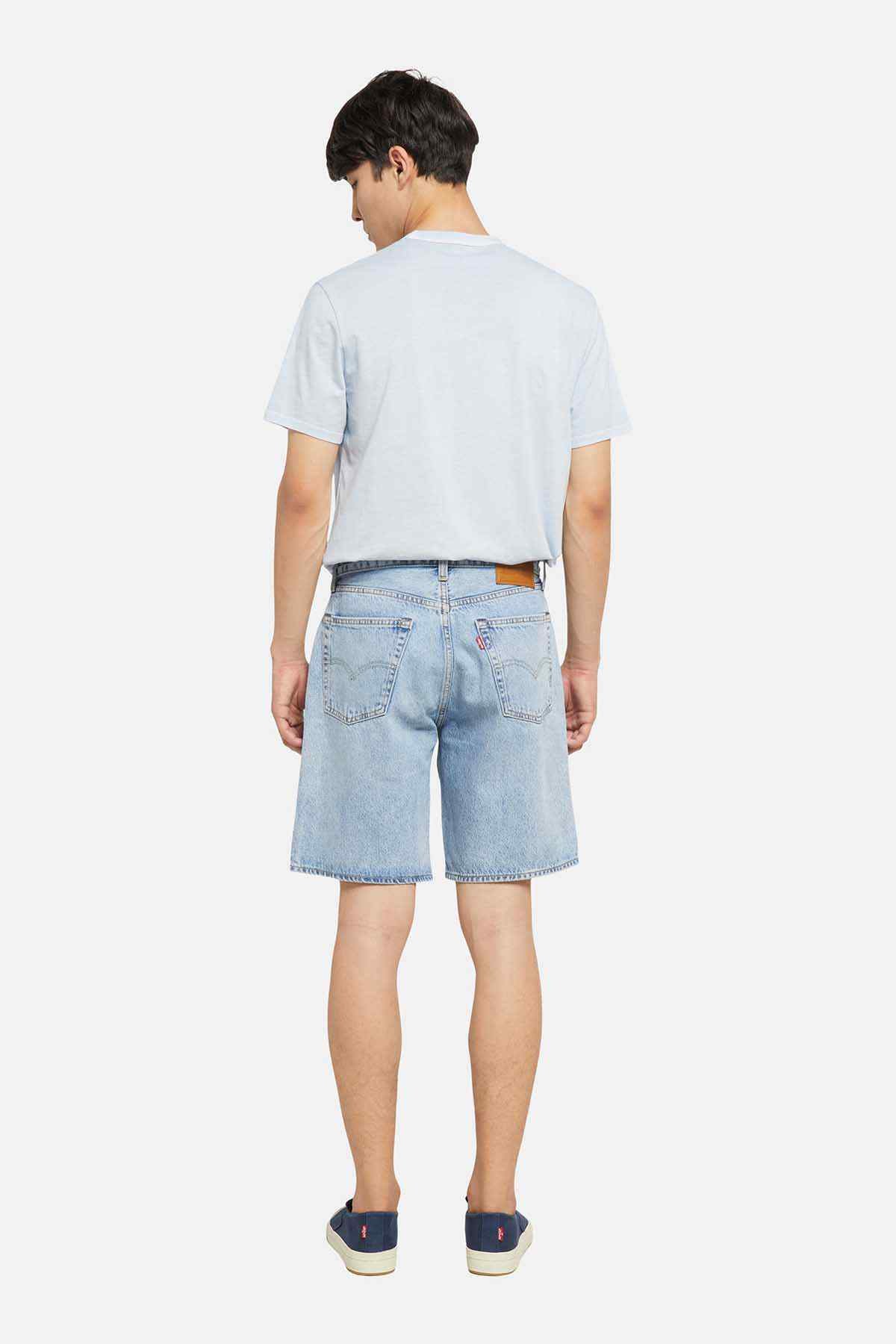Light-wash denim shorts, back view with yoke and rear pockets, knee-length