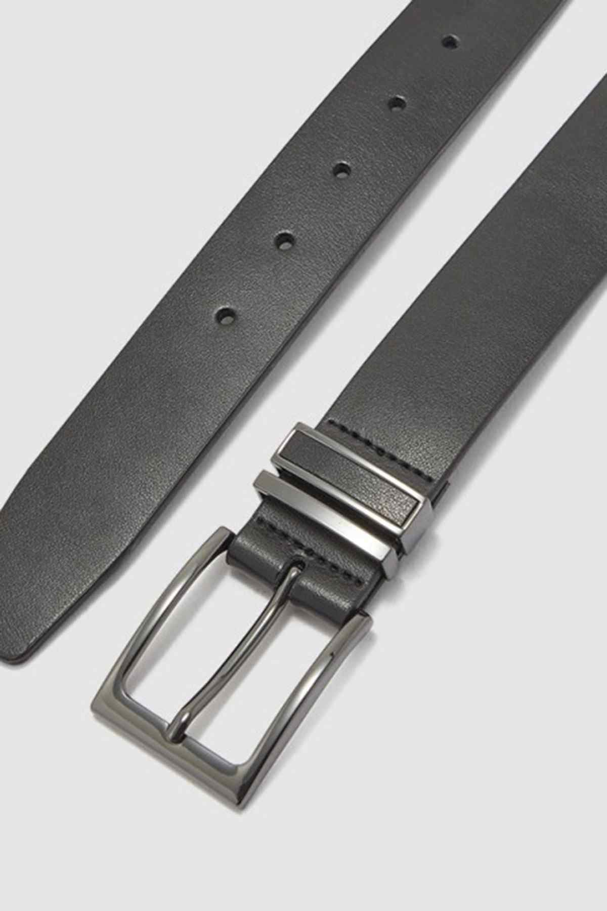 ALDO black belt detail with metal prong buckle and punched adjustment holes