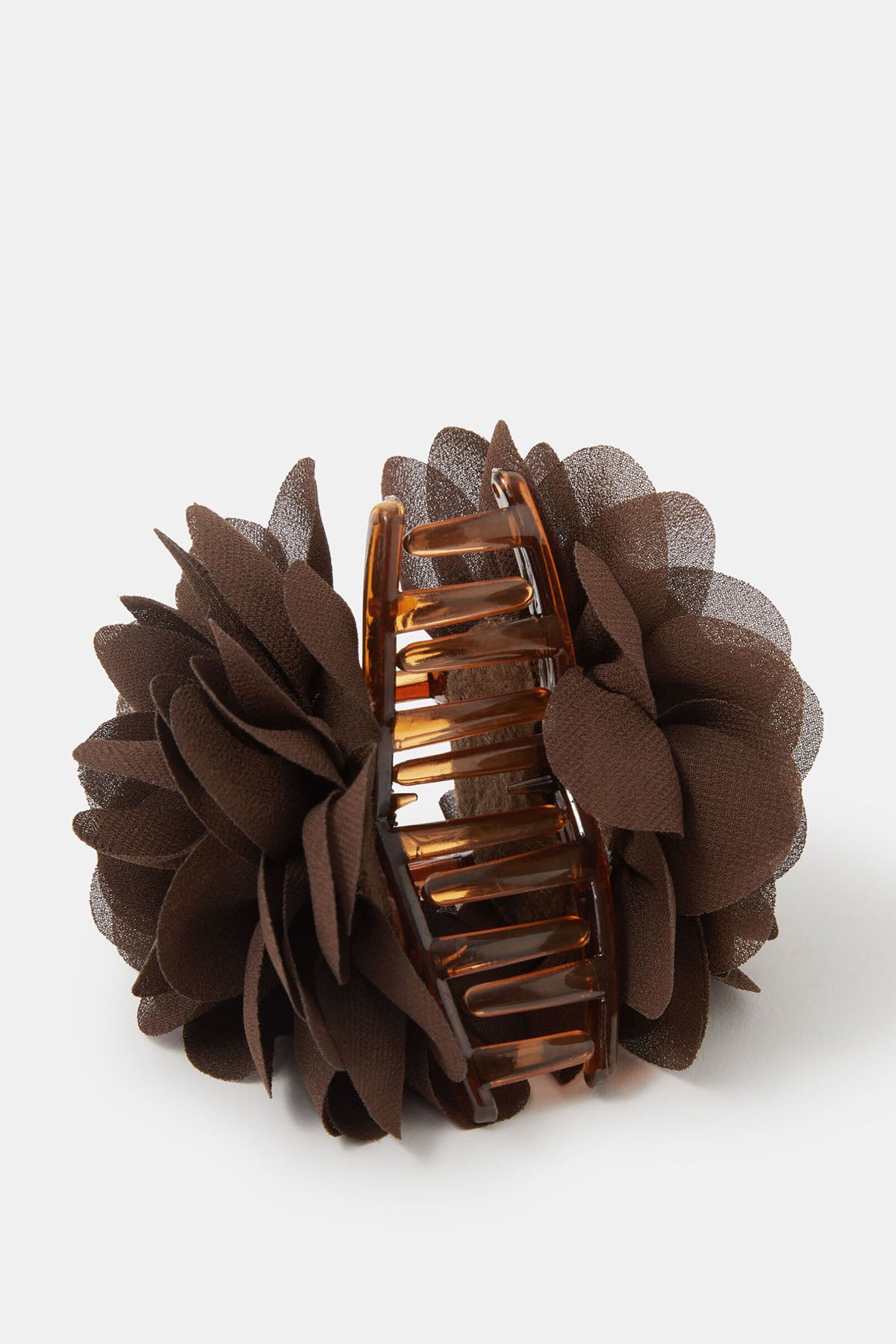 Brown fabric flower hair clip with visible comb teeth