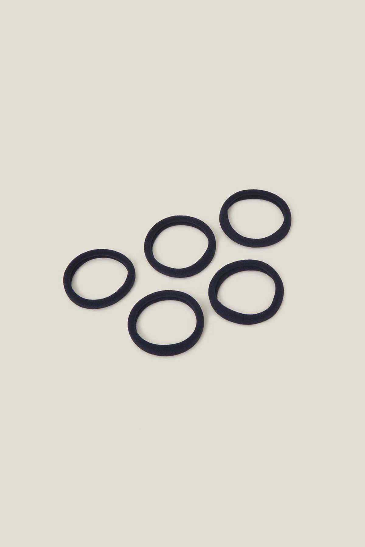 Navy fabric hair tie rings set, five elastic loops on display