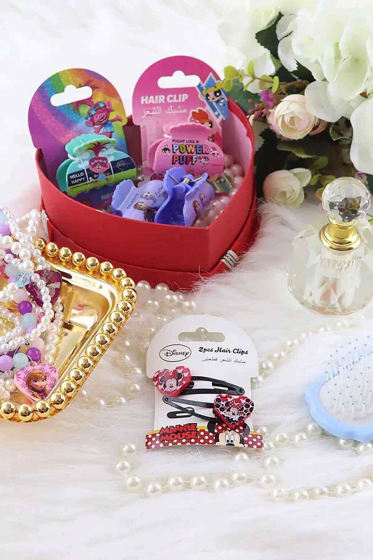 Disney heart-shaped Minnie/Mickey hair clip with black grips, shown in gift bundle