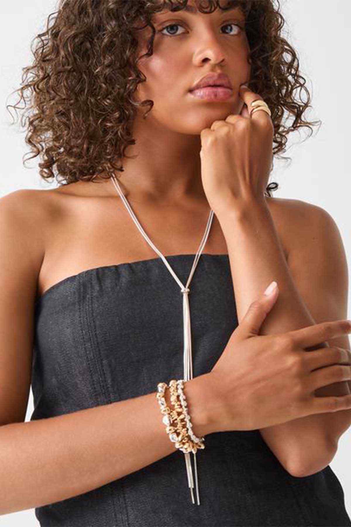 Accessorize silver long necklace detail with small charm and dangling ends