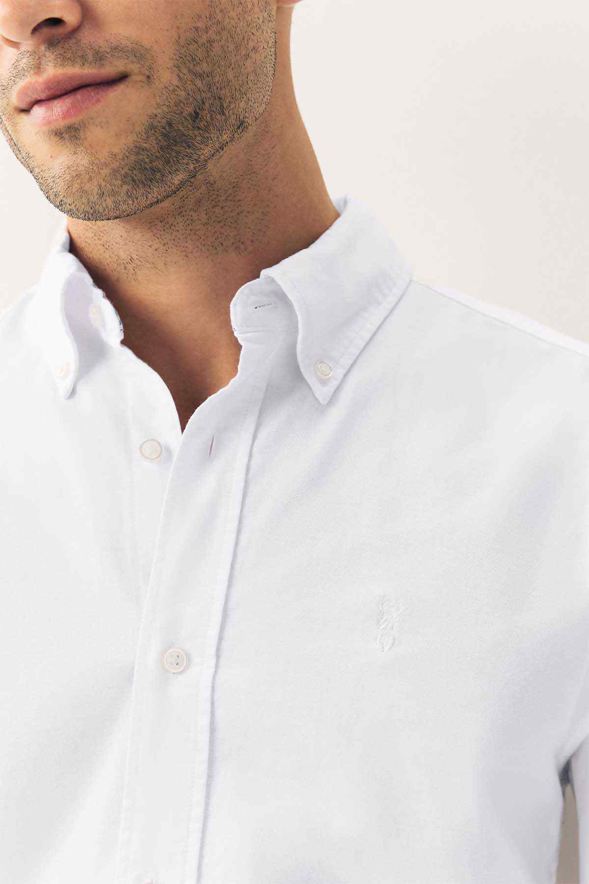 White button-up shirt collar with button placket and neat fold-over front