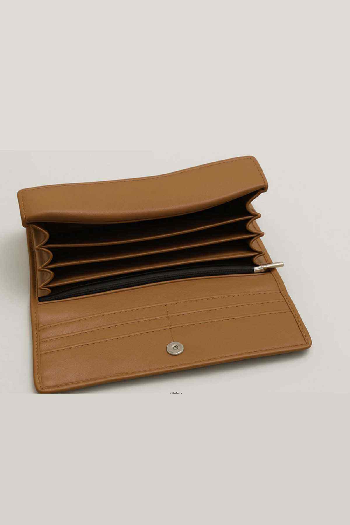 Brown leather wallet open with multiple card slots and snap button