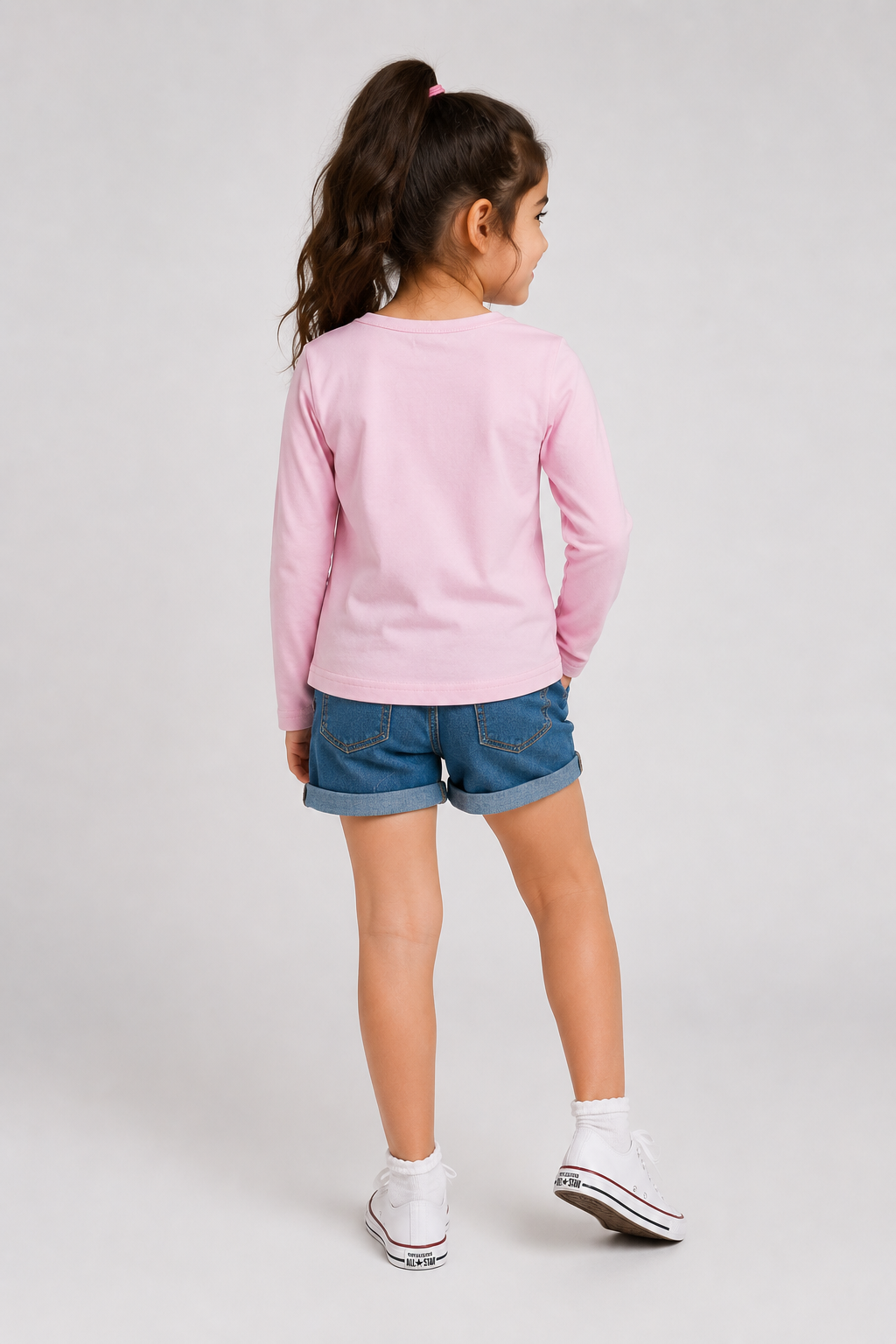 Pink girls long-sleeve top viewed from back, crew neck and straight hem