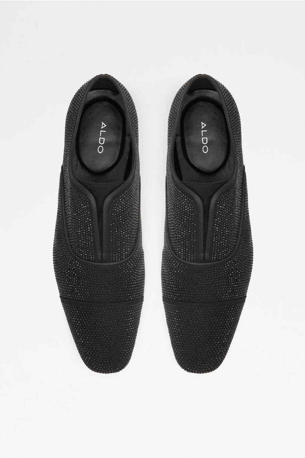 Black textured slip-on loafer with ALDO logo on insole, back view