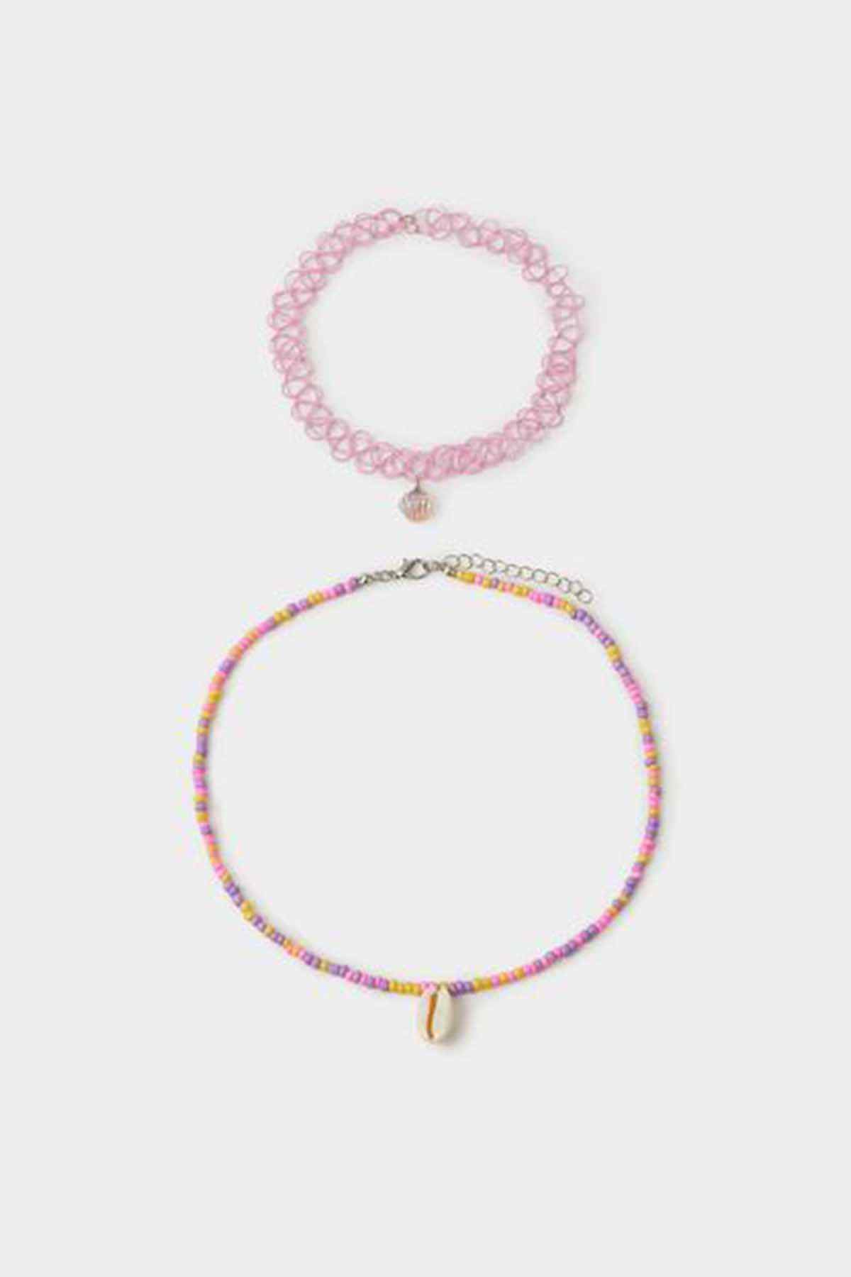 Pastel beaded necklace with small shell pendant; pink coiled bracelet with bead charm