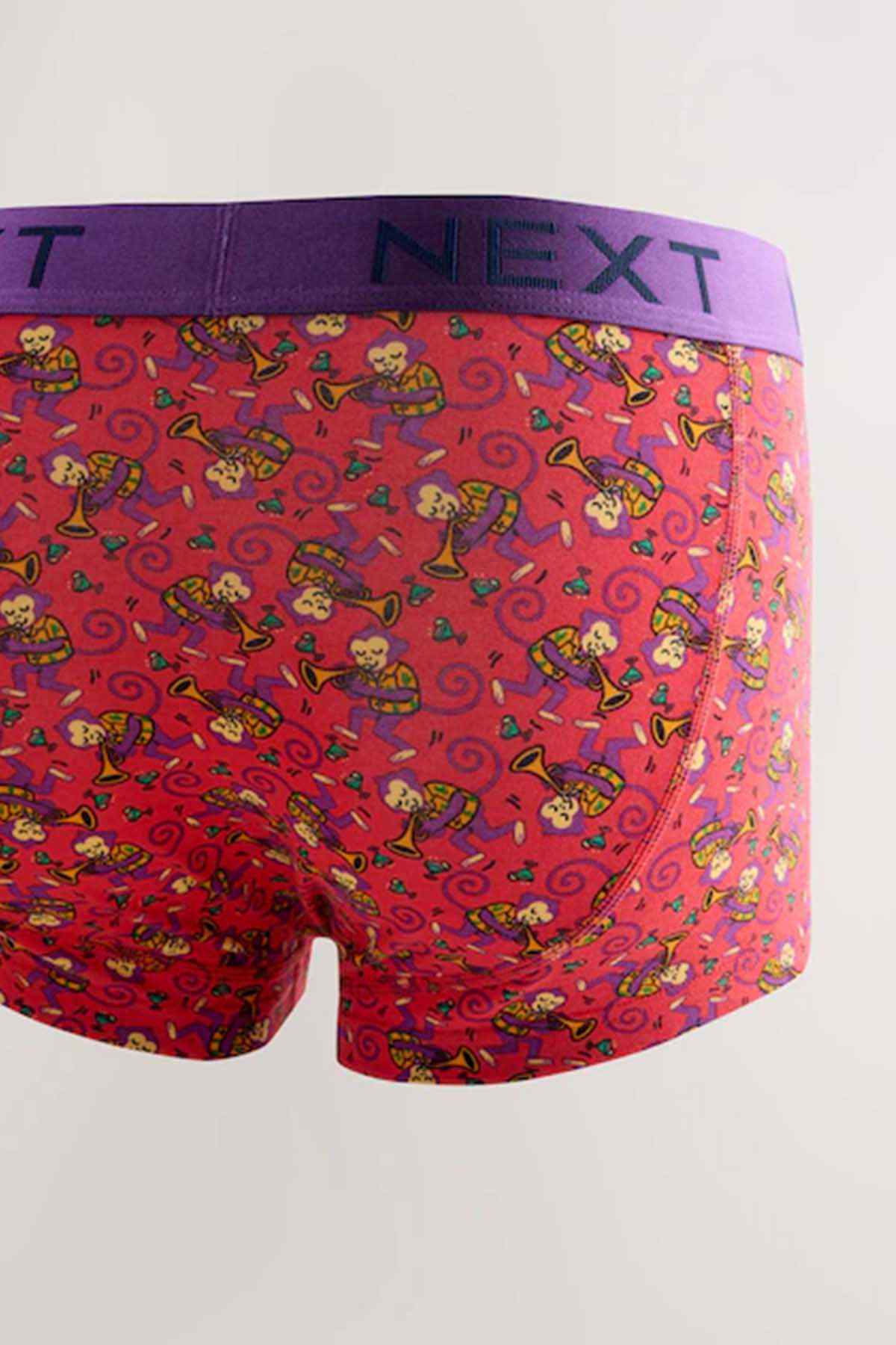 Red boxer shorts with cartoon figure print and purple NEXT waistband