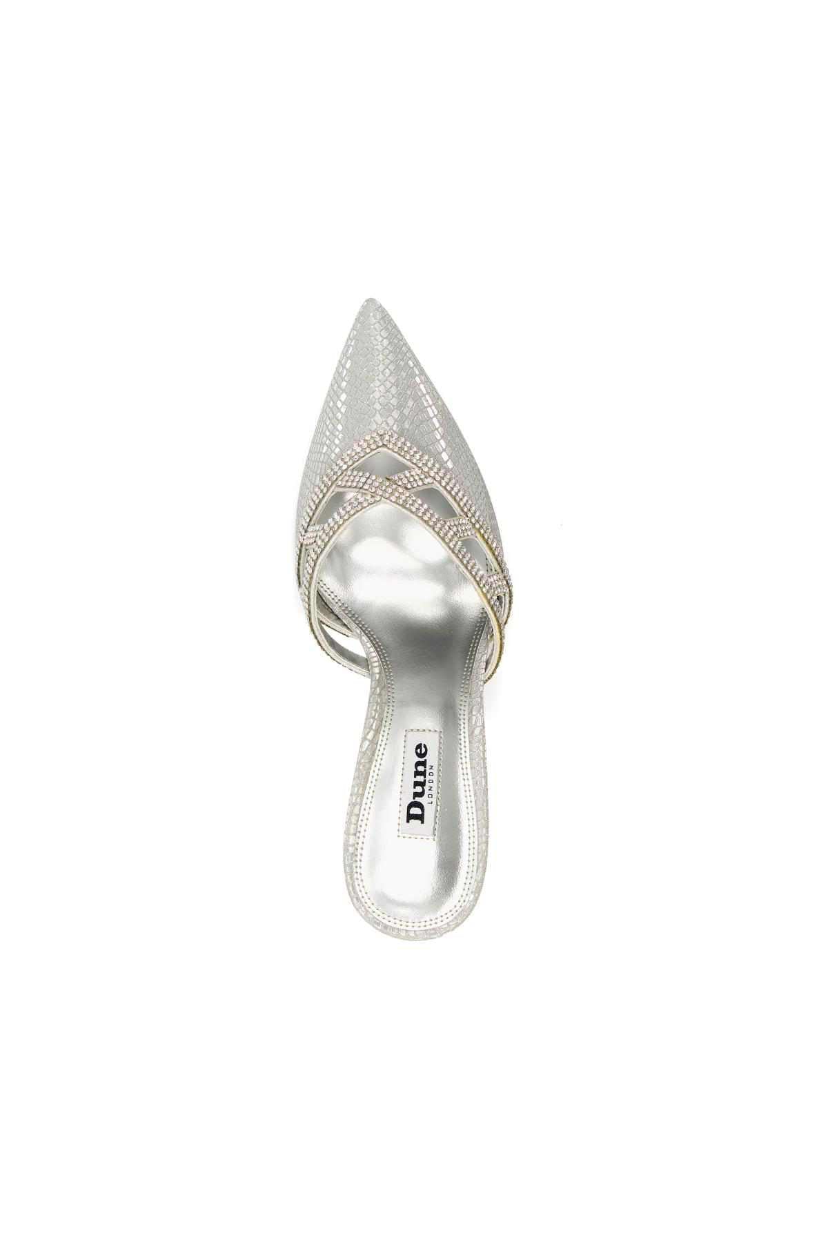 Silver mule sandal with pointed toe and stiletto heel, side view