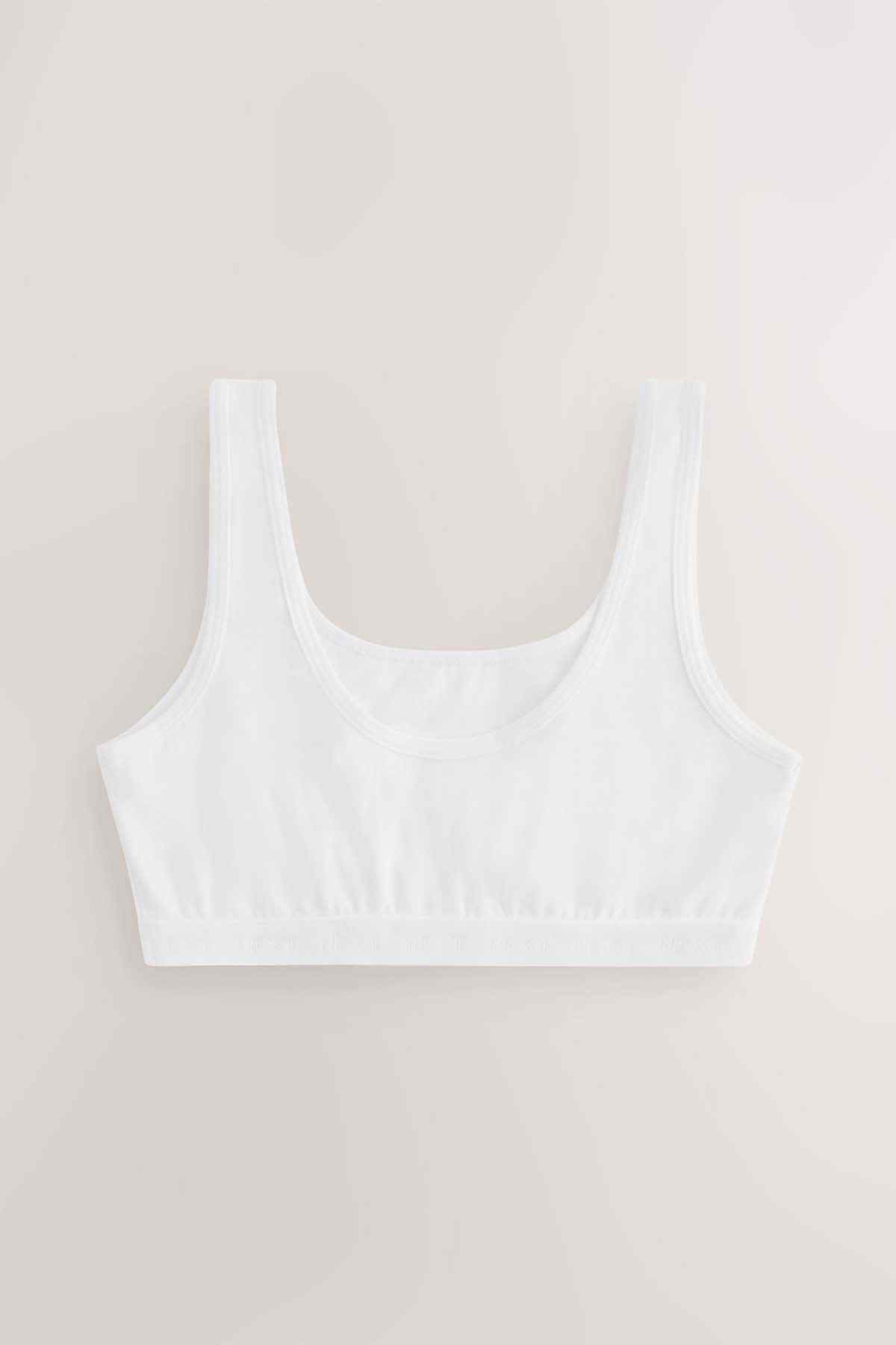 White crop bra with wide straps and smooth underband elastic, front view