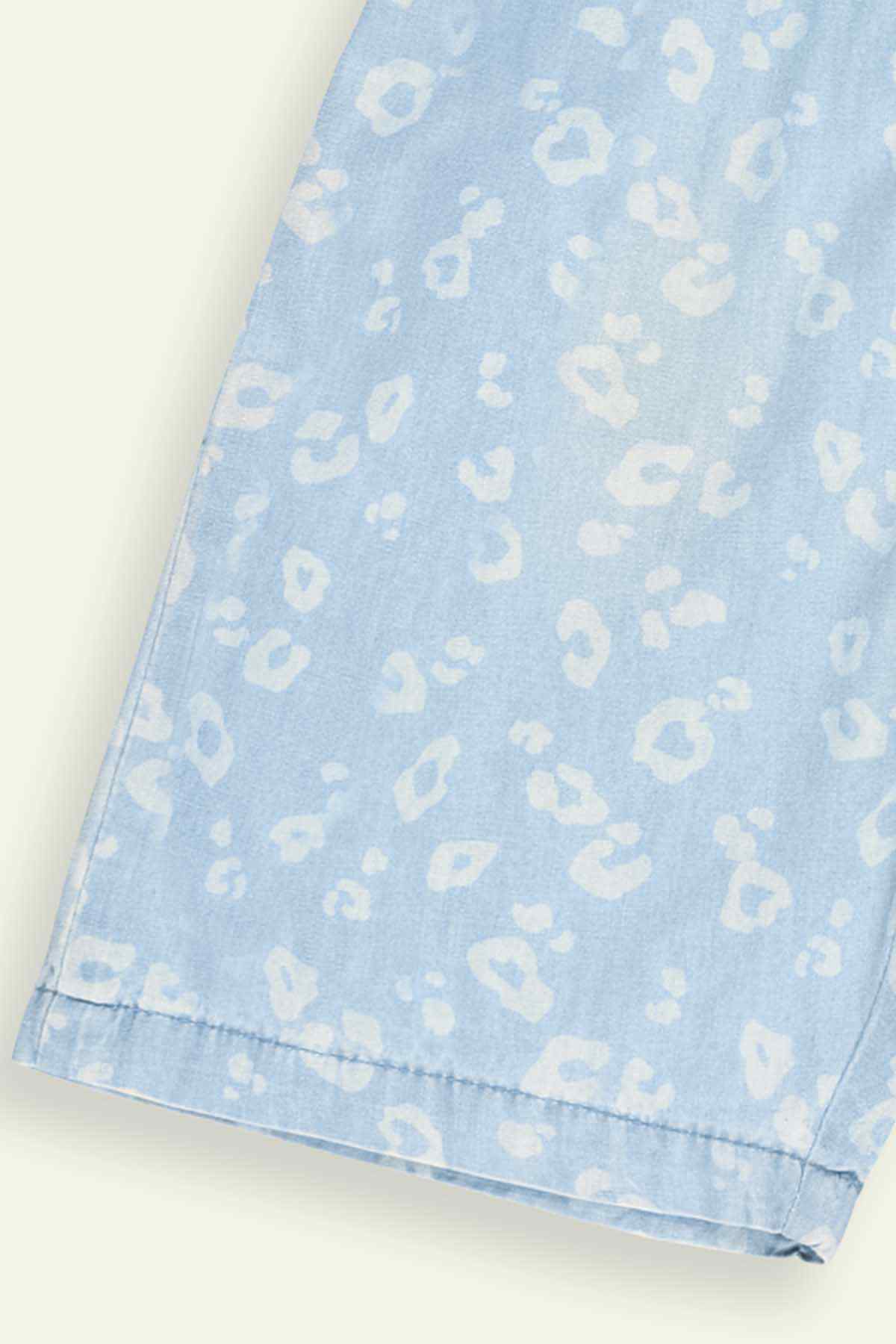 Light blue patterned romper with stitched hem and side seam