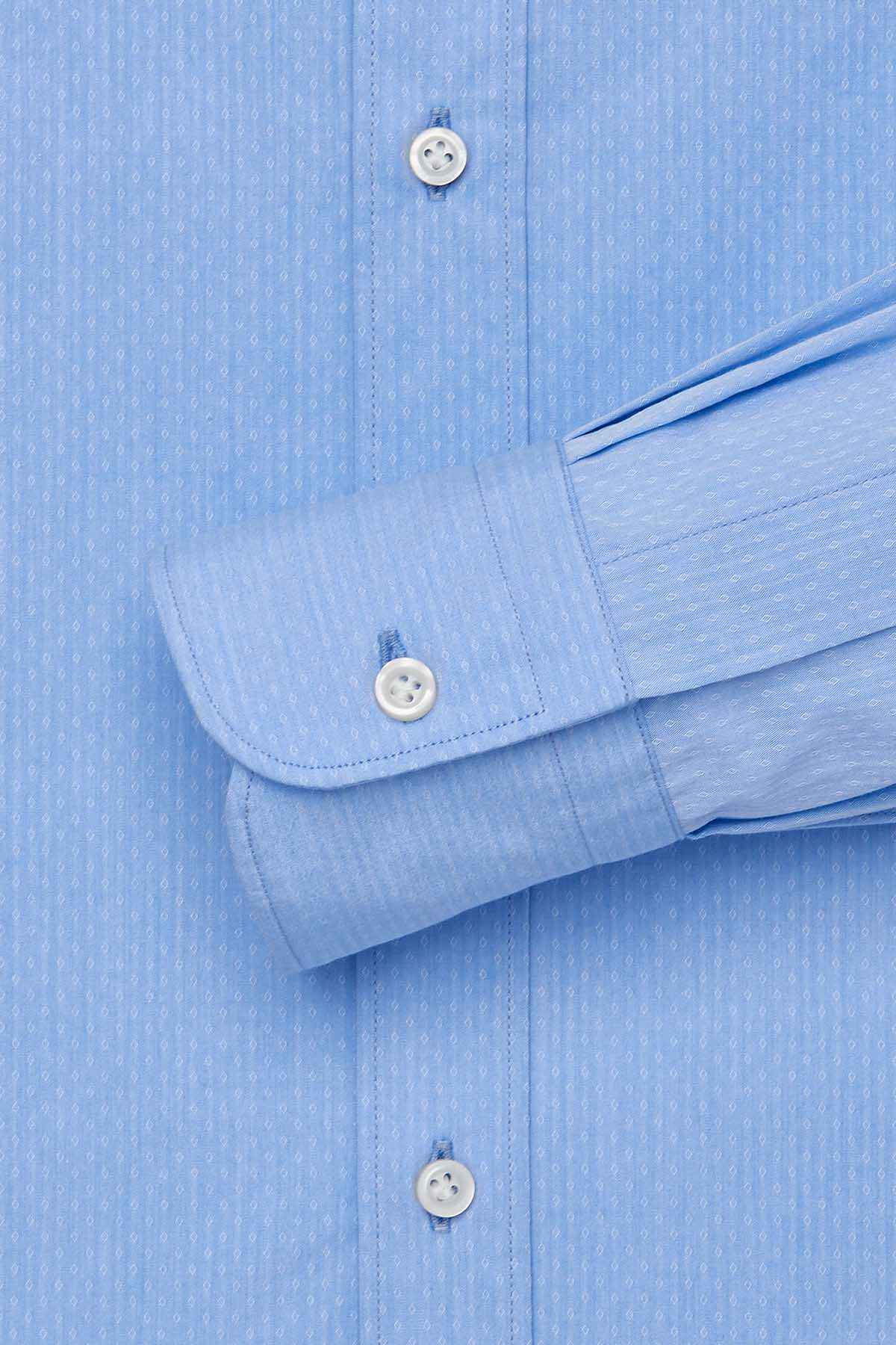 Light blue dress shirt with buttoned cuffs and subtle textured vertical pattern