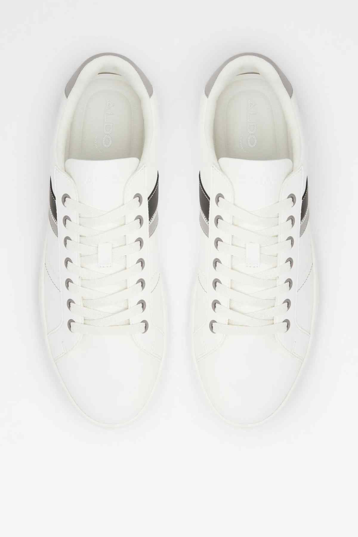 Pair of white lace-up sneakers with black-striped accents and cushioned insoles