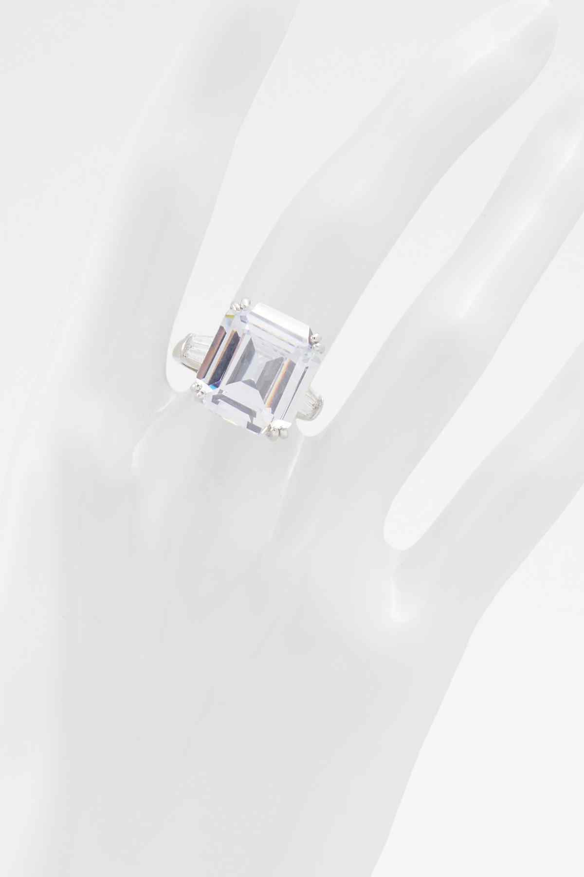 ALDO silver ring with emerald-cut rectangular clear stone, angled view
