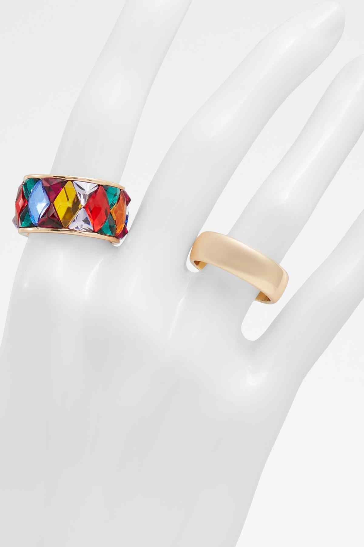 ALDO geometric multicolor stone ring on hand, gold-tone band