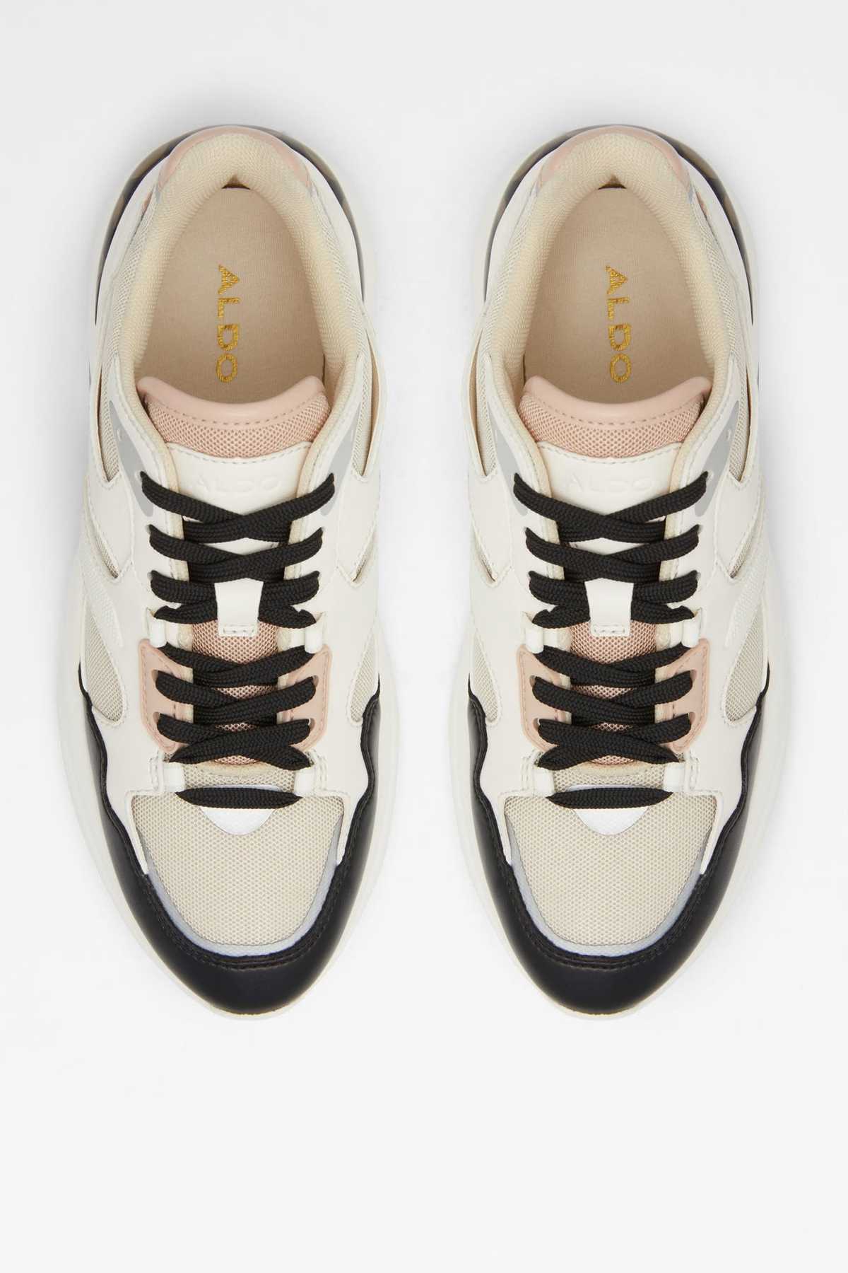 Pair of bone and black lace-up sneakers with ALDO logo on tongue